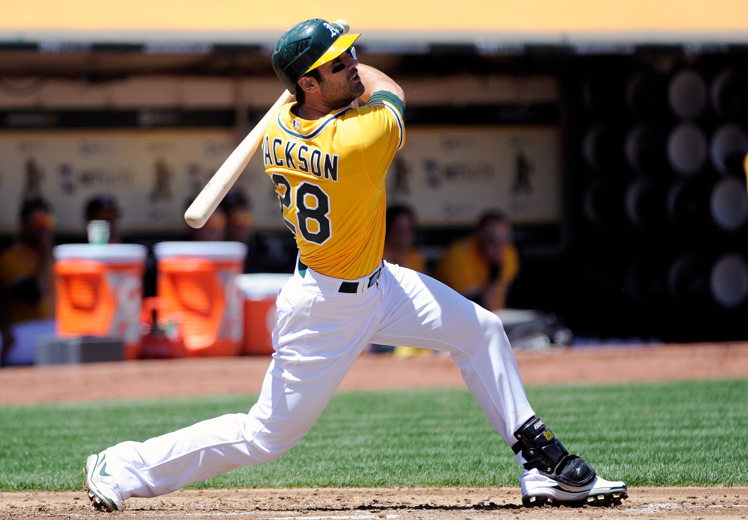 OAKLAND, CA - MAY 1: Conor Jackson #28 of the Oakland Athletics hits a double to drive in two runs in the bottom of the first inning against the Texas Rangers during a MLB baseball game at the Oakland-Alameda County Coliseum May 1, 2011 in Oakland, Califo OAKLAND, CA - MAY 1: Conor Jackson #28 of the Oakland Athletics hits a double to drive in two runs in the bottom of the first inning against the Texas Rangers during a MLB baseball game at the Oakland-Alameda County Coliseum May 1, 2011 in Oakland, Califo