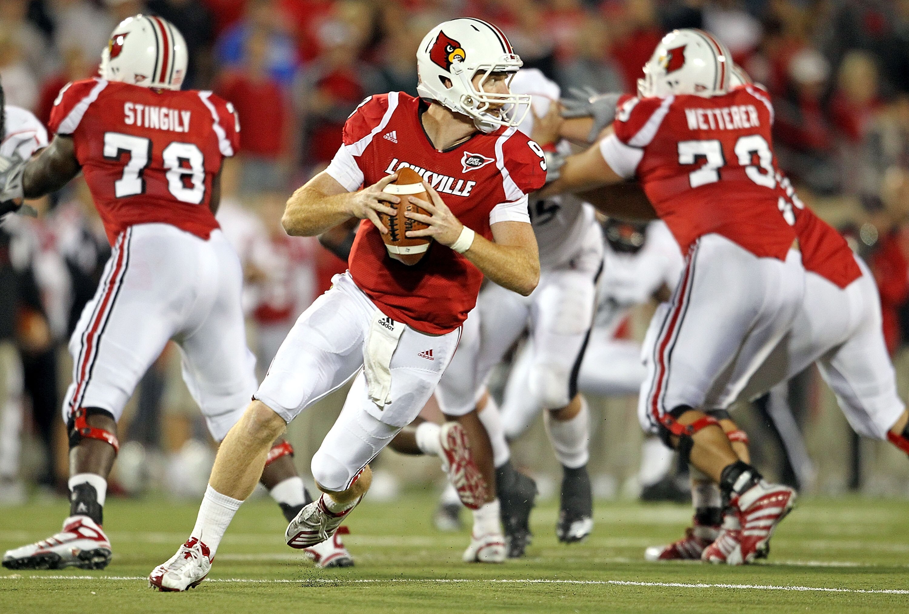 LOUISVILLE, KY - OCTOBER 15:  Adam Froman #9 of  the Louisville Cardinals runs with the ball during the Big East Conference game against the Cincinnati Bearcats at Papa John's Cardinal Stadium on October 15, 2010 in Louisville, Kentucky.  (Photo by Andy L
