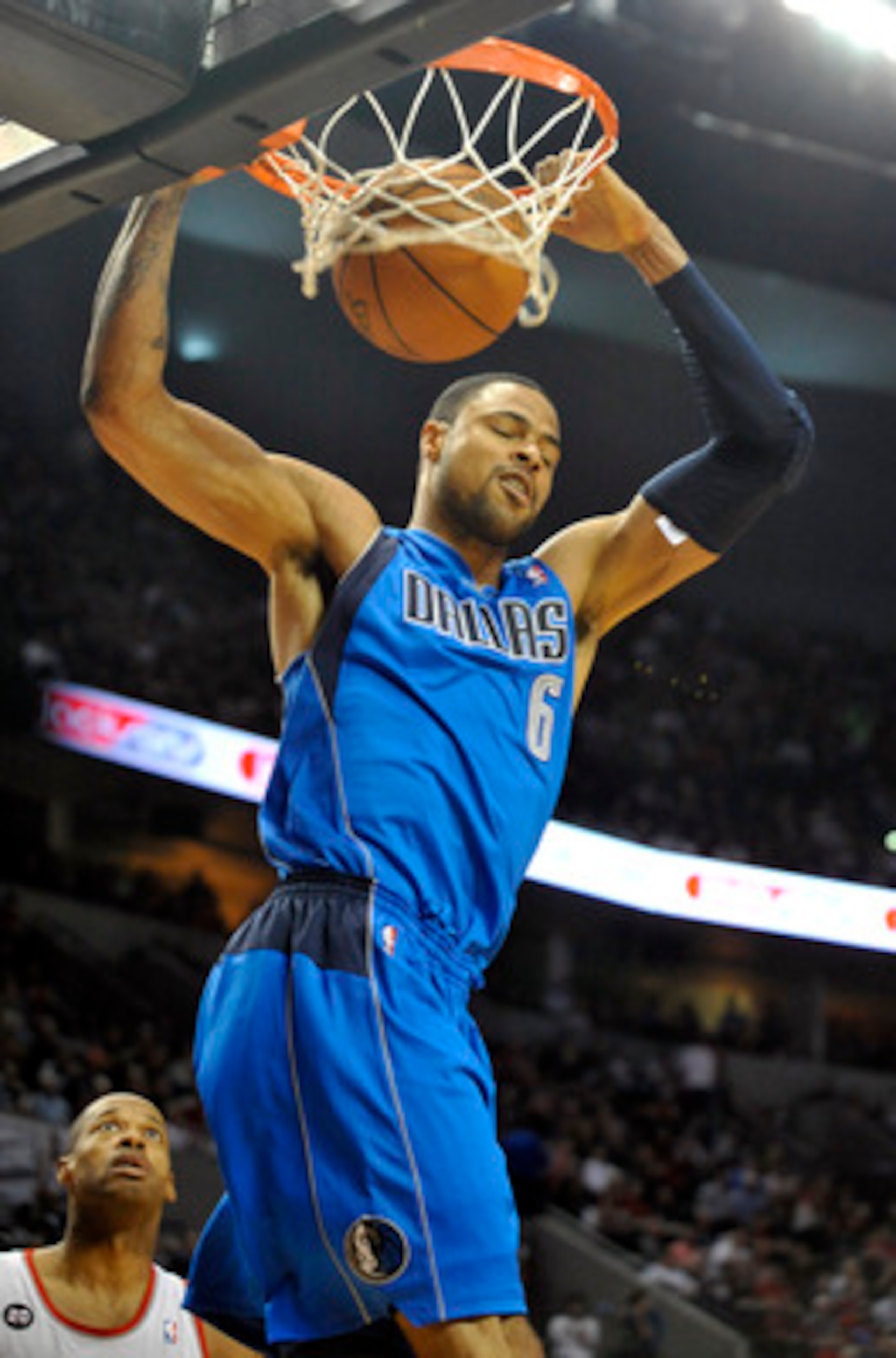 PORTLAND, OR - APRIL 28: Tyson Chandler #6 of the Dallas Mavericks dunks over Marcus Camby #23 of the Portland Trail Blazers during the first quarter of Game Six of the Western Conference Quartefinals in the 2011 NBA Playsoffs on April 28, 2011 at the Ros