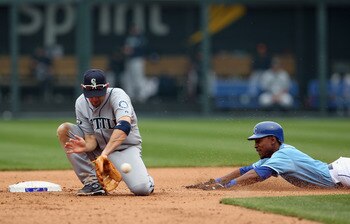 KANSAS CITY, MO - APRIL 17:  Jack Wilson #2 of the Seattle Mariners fields a throw as Jarrod Dyson #1 of the Kansas City Royals attaempts to steal second during the game on April 17, 2011 at Kauffman Stadium in Kansas City, Missouri.  (Photo by Jamie Squi