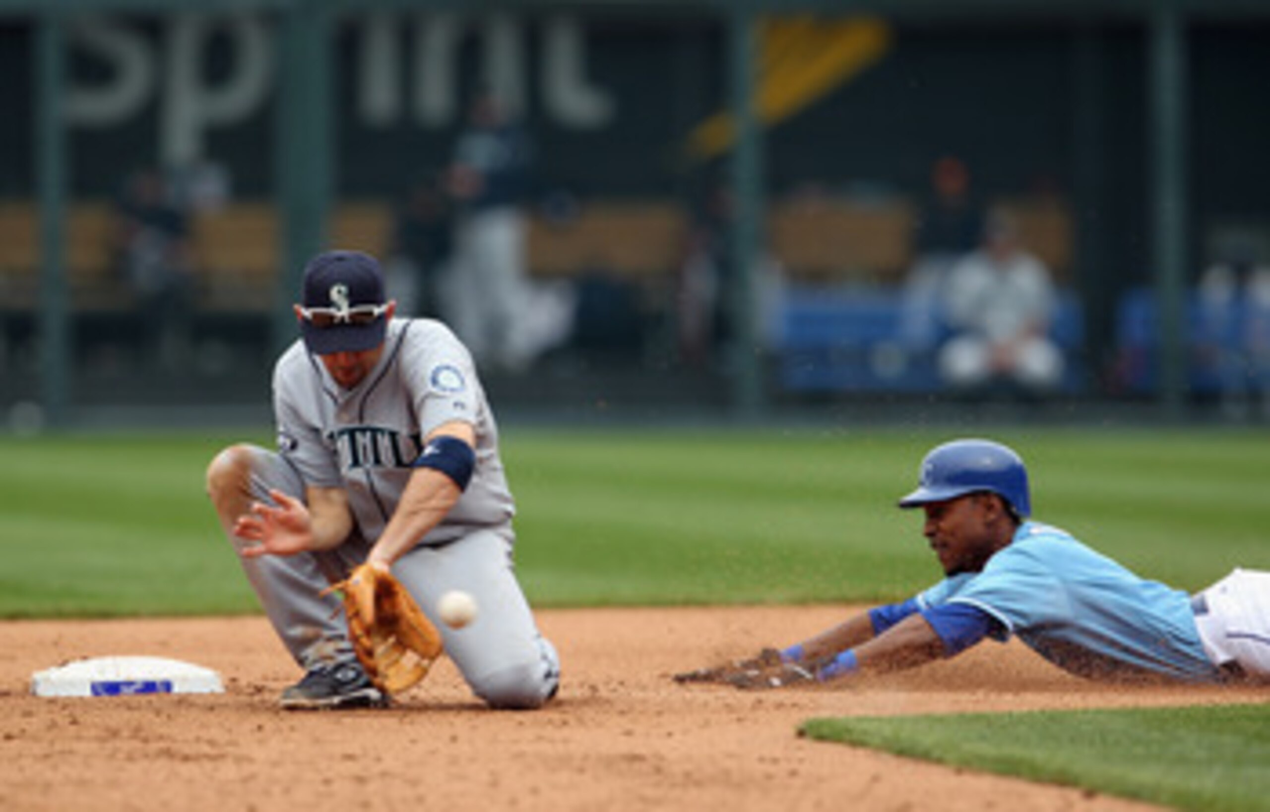 KANSAS CITY, MO - APRIL 17:  Jack Wilson #2 of the Seattle Mariners fields a throw as Jarrod Dyson #1 of the Kansas City Royals attaempts to steal second during the game on April 17, 2011 at Kauffman Stadium in Kansas City, Missouri.  (Photo by Jamie Squi