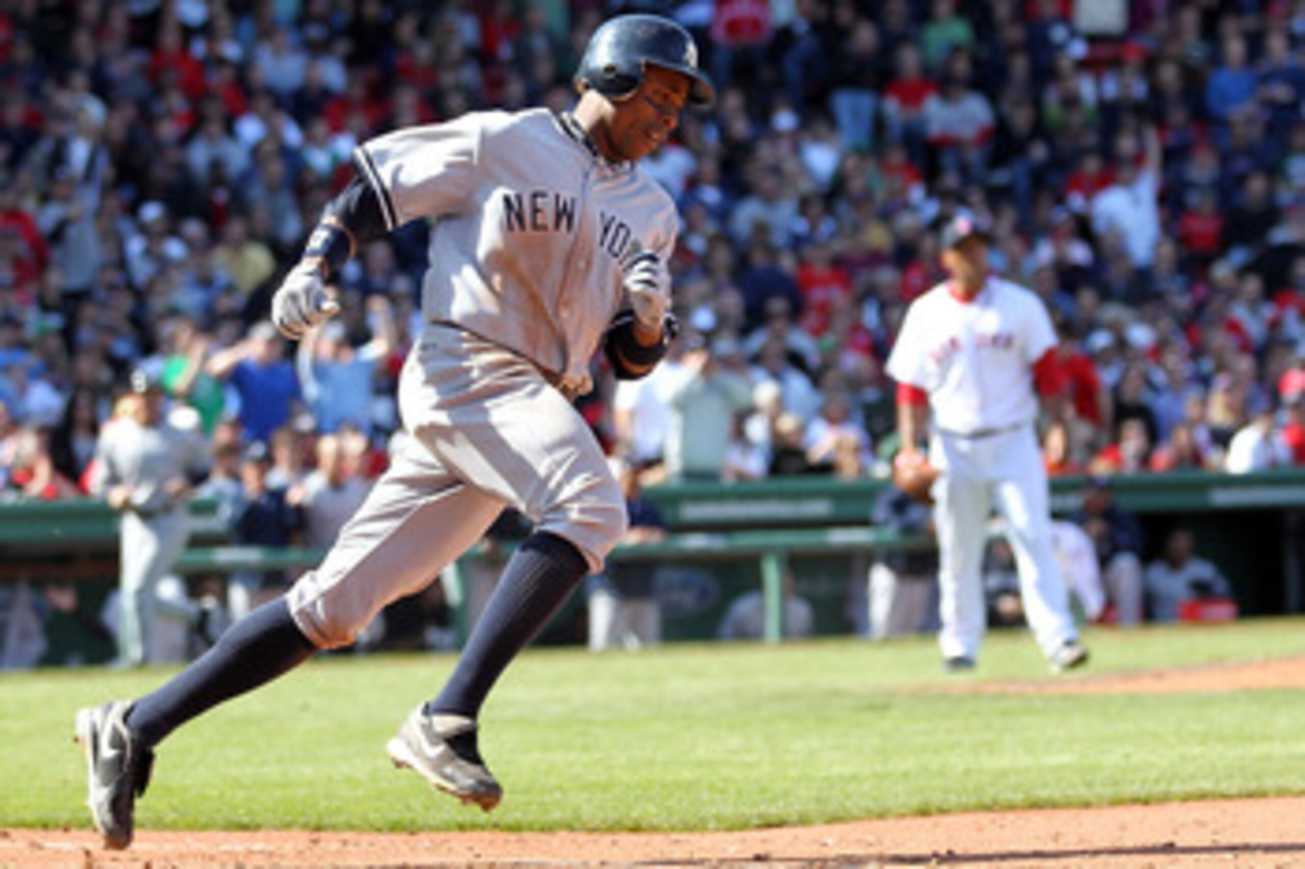 BOSTON, MA - APRIL 9:  Curtis Granderson #14 of the New York Yankees rounds the bases after hitting a home run off of Felix Doubront #61 of the Boston Red Sox at Fenway Park April 9, 2011 in Boston, Massachusetts. (Photo by Jim Rogash/Getty Images)