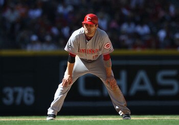 PHOENIX, AZ - APRIL 10:  Joey Votto #19 of the Cincinnati Reds leads off first base during the Major League Baseball game against the Arizona Diamondbacks at Chase Field on April 10, 2011 in Phoenix, Arizona.   The Diamondbacks defeated the Reds 10-8.  (P