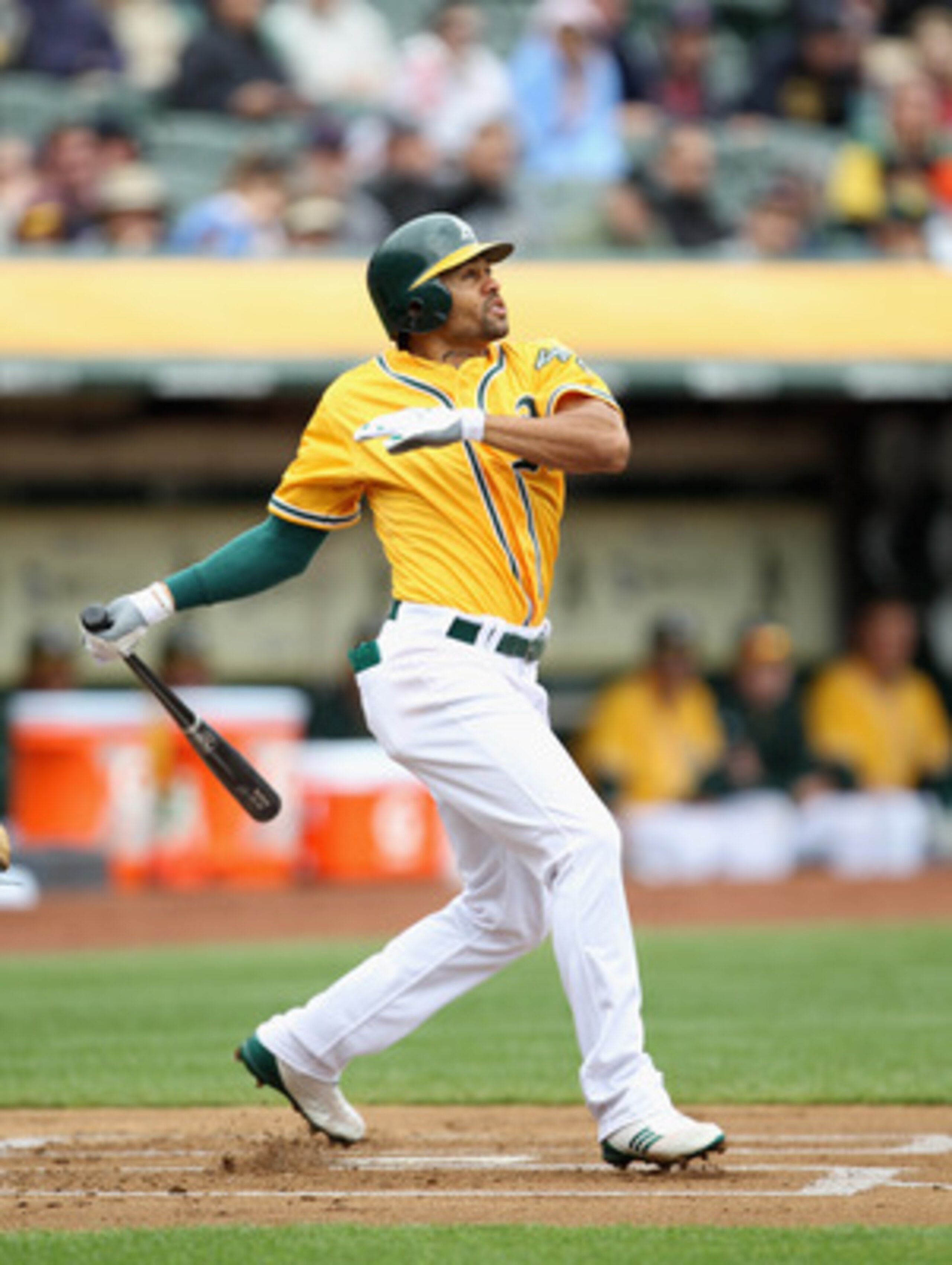 OAKLAND, CA - APRIL 20:  Coco Crisp #4 of the Oakland Athletics hits a lead off home run against the Boston Red Sox at Oakland-Alameda County Coliseum on April 20, 2011 in Oakland, California.  (Photo by Ezra Shaw/Getty Images)
