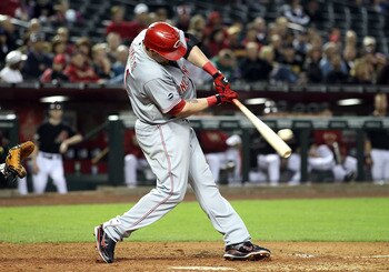 PHOENIX, AZ - APRIL 09:  Jonny Gomes #31 of the Cincinnati Reds hits a 2 RBI double against the Arizona Diamondbacks during the ninth inning of the Major League Baseball game at Chase Field on April 9, 2011 in Phoenix, Arizona.  (Photo by Christian Peters