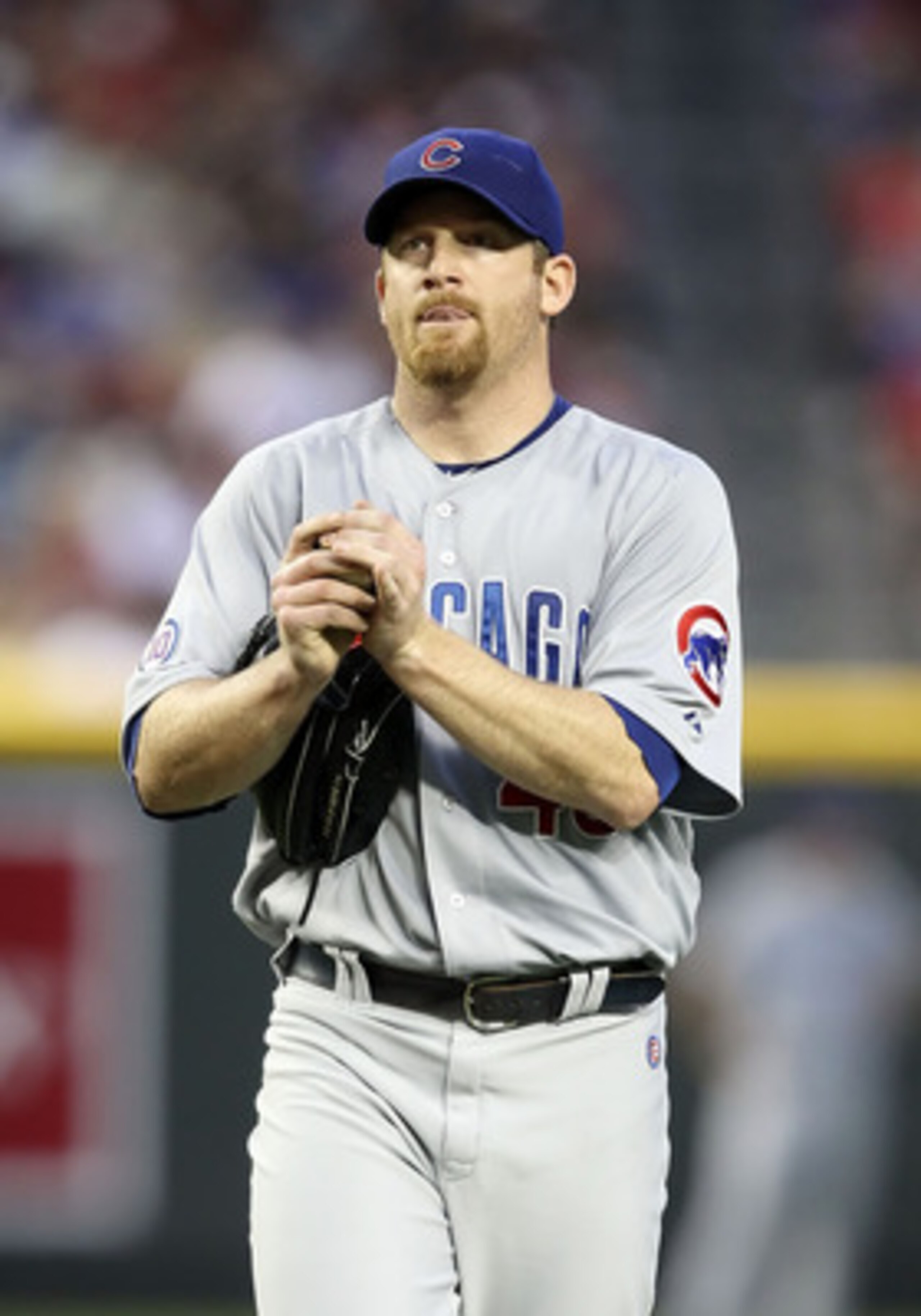 PHOENIX, AZ - APRIL 28:  Starting pitcher Ryan Dempster #46 of the Chicago Cubs reacts on the mound during the first inning of the Major League Baseball game at Chase Field on April 28, 2011 in Phoenix, Arizona.  (Photo by Christian Petersen/Getty Images)