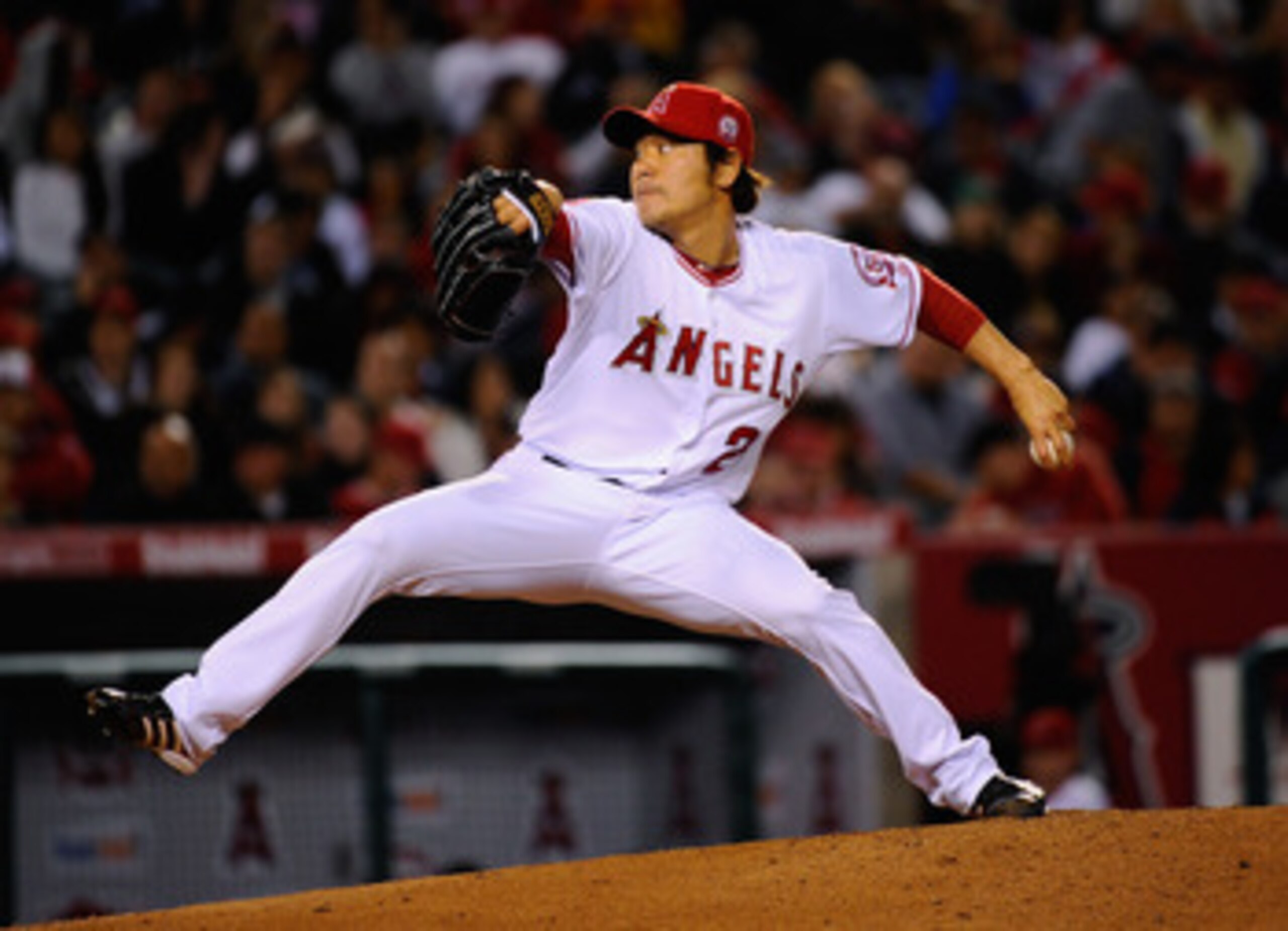 ANAHEIM, CA - APRIL 21:  Pitcher Hisanori Takahashi #21 of the Los Angeles Angels of Anaheim throws a pitch against the Boston Red Sox during the baseball game at Angel Stadium of Anaheim on April 21, 2011 in Anaheim, California.  (Photo by Kevork Djansez
