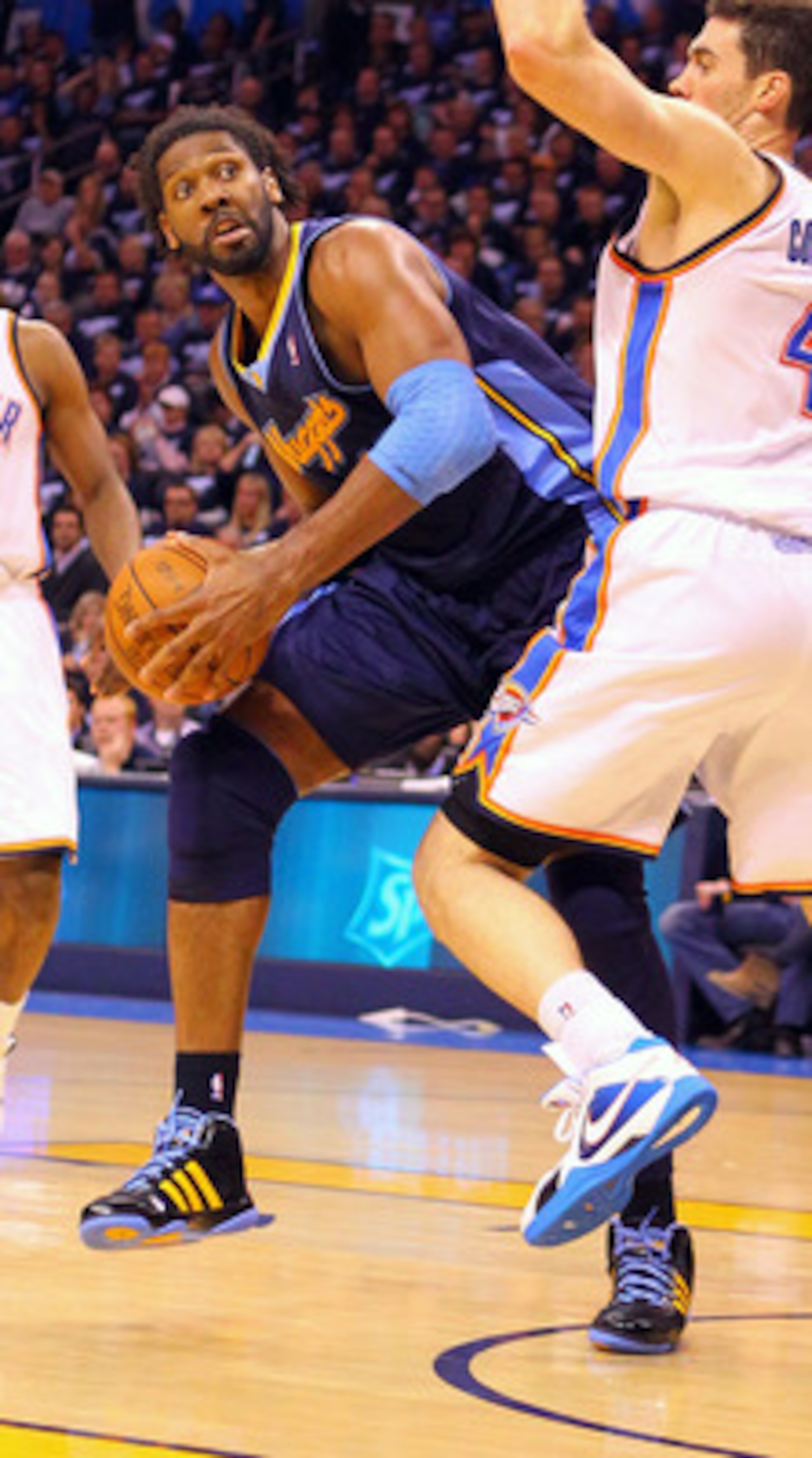 OKLAHOMA CITY, OK - APRIL 27: Nene Hilario #31 of the Denver Nuggets looks to shoot the ball against Nick Collison #4 of the Oklahoma City Thunder in Game Five of the Western Conference Quarterfinals in the 2011 NBA Playoffs on April 27, 2011 at the Ford