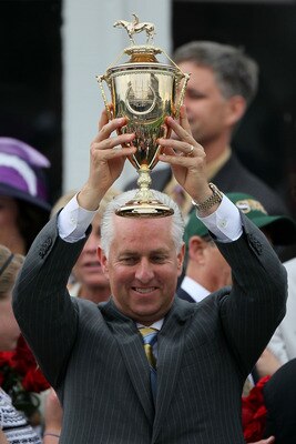 LOUISVILLE, KY - MAY 01:  Trainer Todd Pletcher holds the 136th Kentucky Derby trophy in the winners circle after his win with Super Saver on May 1, 2010 in Louisville, Kentucky.  (Photo by Andy Lyons/Getty Images)