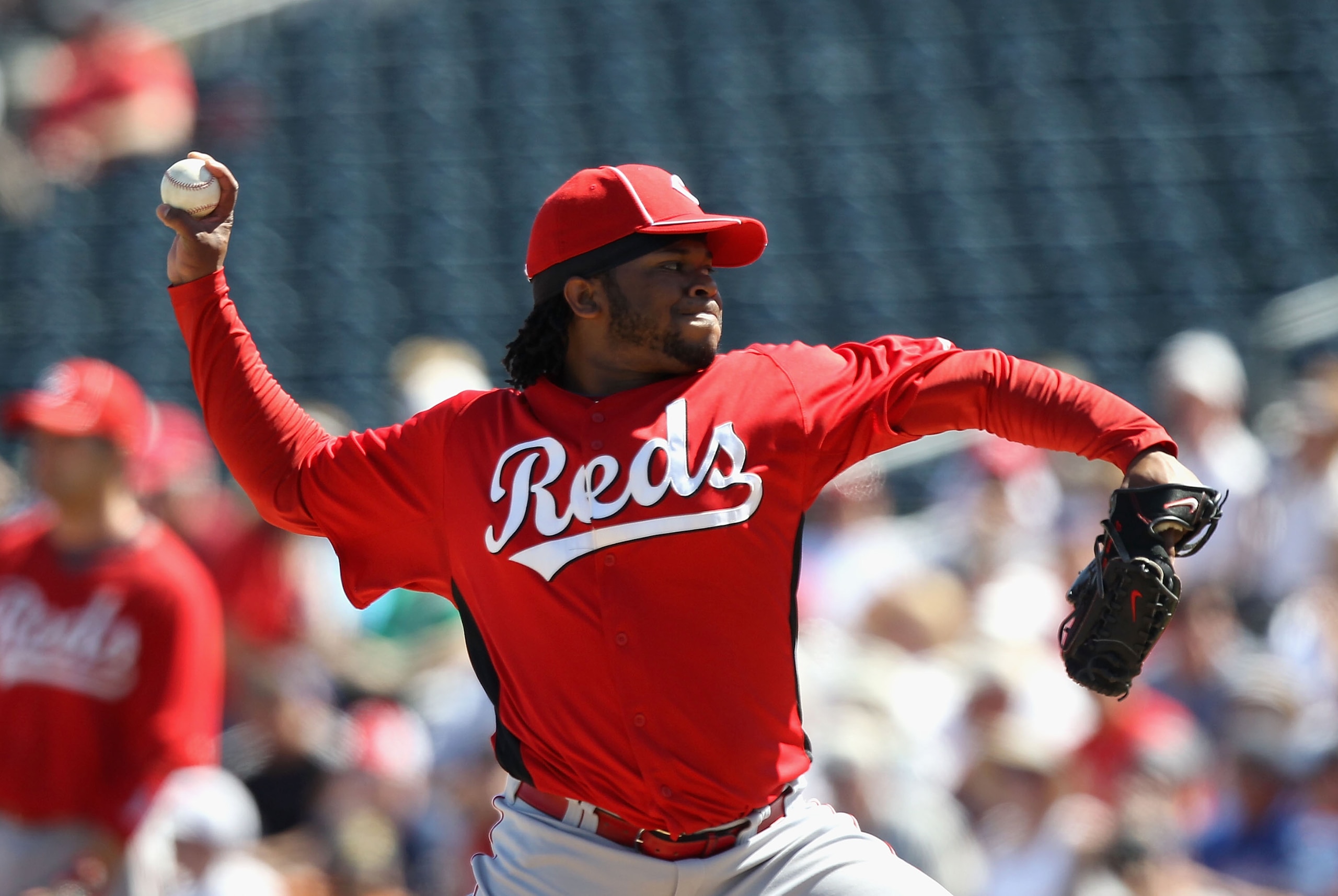 SURPRISE, AZ - MARCH 11:  Starting pitcher Johnny Cueto #47 of the Cincinnati Reds pitches against the Texas Rangers during the spring training game at Surprise Stadium on March 11, 2011 in Surprise, Arizona.  (Photo by Christian Petersen/Getty Images)