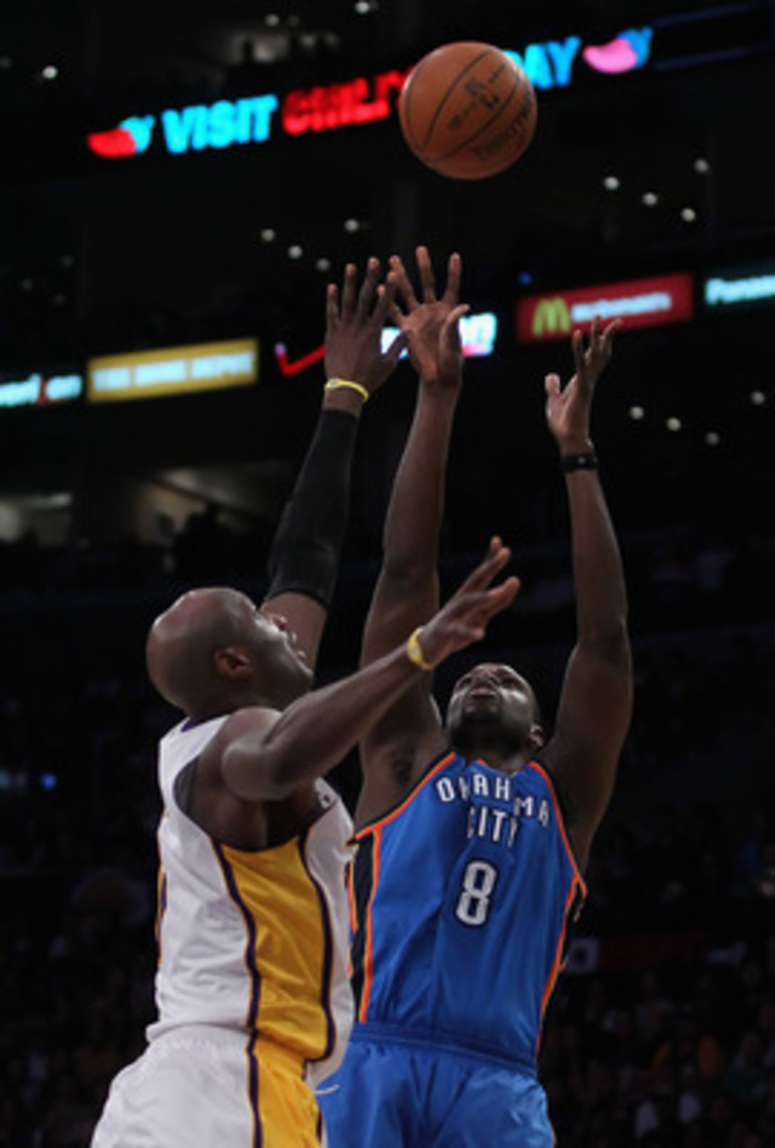 LOS ANGELES, CA - APRIL 10:  Nazr Mohammed #8 of the Oklahoma City Thunder shoots over Lamar Odom #7 of the Los Angeles Lakers in the second half at Staples Center on April 10, 2011 in Los Angeles, California. The Thunder defeated the Lakers 120-106. NOTE