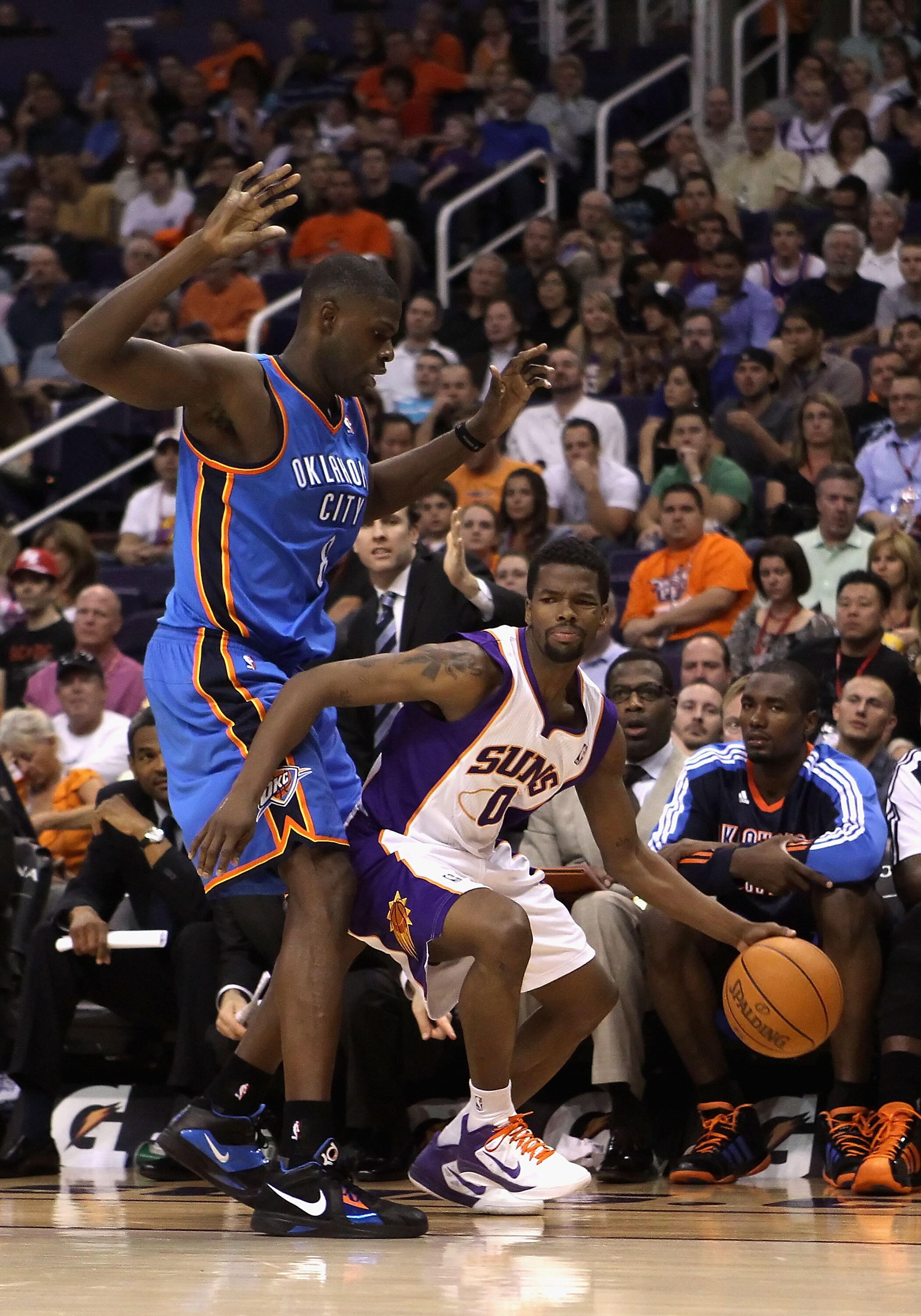 PHOENIX, AZ - MARCH 30:  Aaron Brooks #0 of the Phoenix Suns handles the ball during the NBA game against the Oklahoma City Thunder at US Airways Center on March 30, 2011 in Phoenix, Arizona.  The Thunder defeated the Suns 116-98. NOTE TO USER: User expre