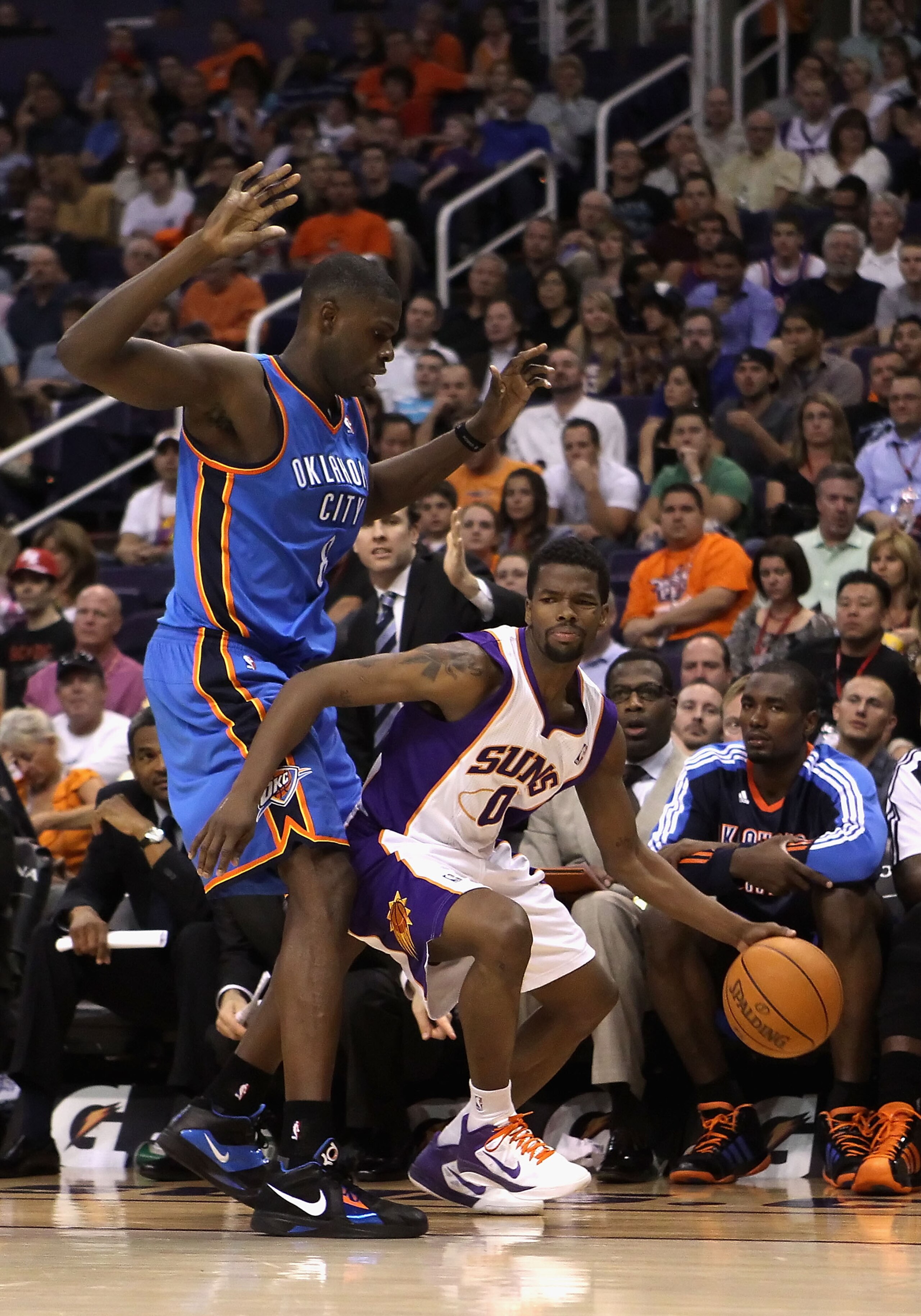 PHOENIX, AZ - MARCH 30: Aaron Brooks #0 of the Phoenix Suns handles the ball during the NBA game against the Oklahoma City Thunder at US Airways Center on March 30, 2011 in Phoenix, Arizona. The Thunder defeated the Suns 116-98. NOTE TO USER: User expre PHOENIX, AZ - MARCH 30: Aaron Brooks #0 of the Phoenix Suns handles the ball during the NBA game against the Oklahoma City Thunder at US Airways Center on March 30, 2011 in Phoenix, Arizona. The Thunder defeated the Suns 116-98. NOTE TO USER: User expre