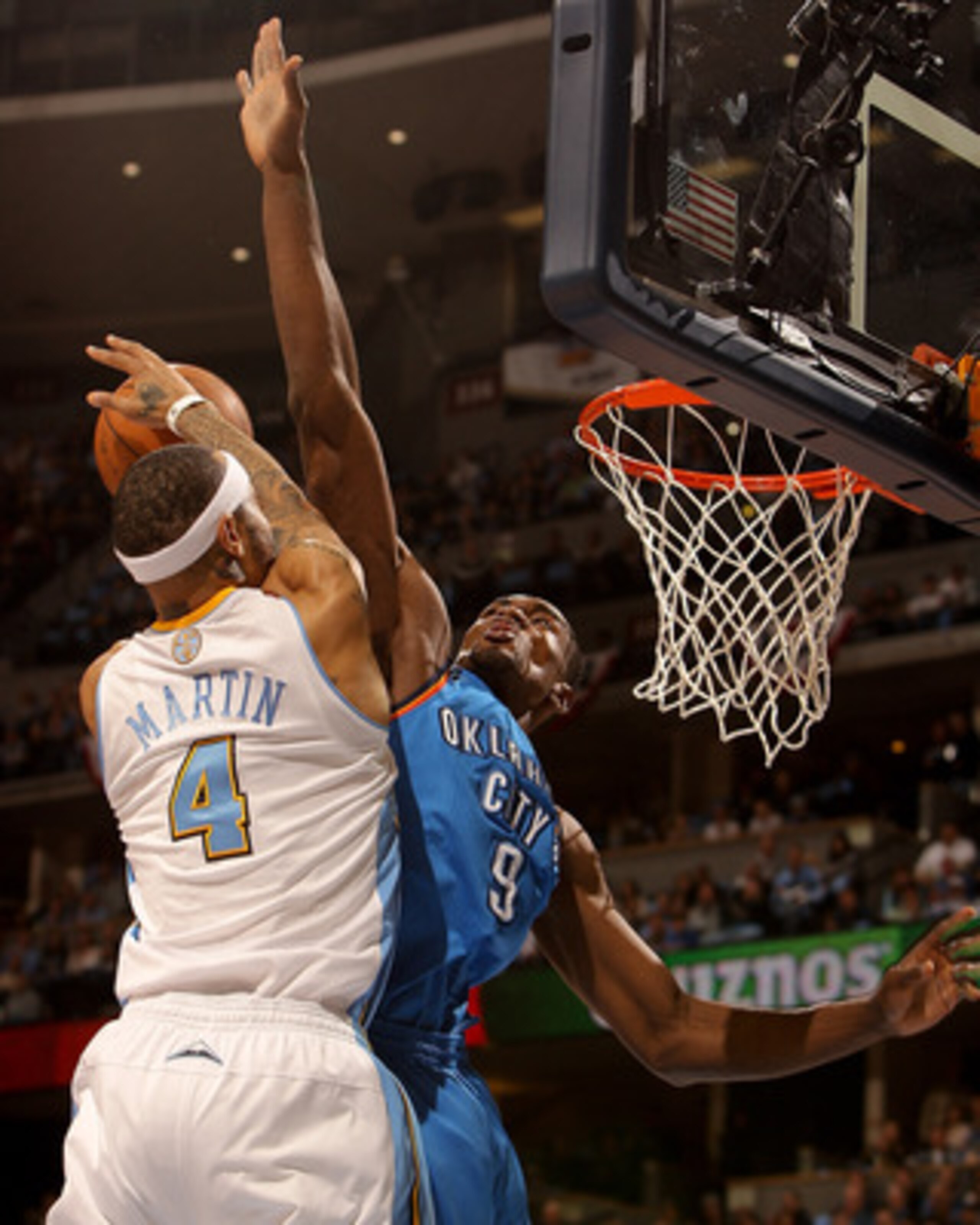 DENVER, CO - APRIL 25:  Serge Ibaka #9 of the Oklahoma City Thunder fouls Kenyon Martin #4 of the Denver Nuggets in Game Four of the Western Conference Quarterfinals in the 2011 NBA Playoffs at Pepsi Center on April 25, 2011 in Denver, Colorado. NOTE TO U