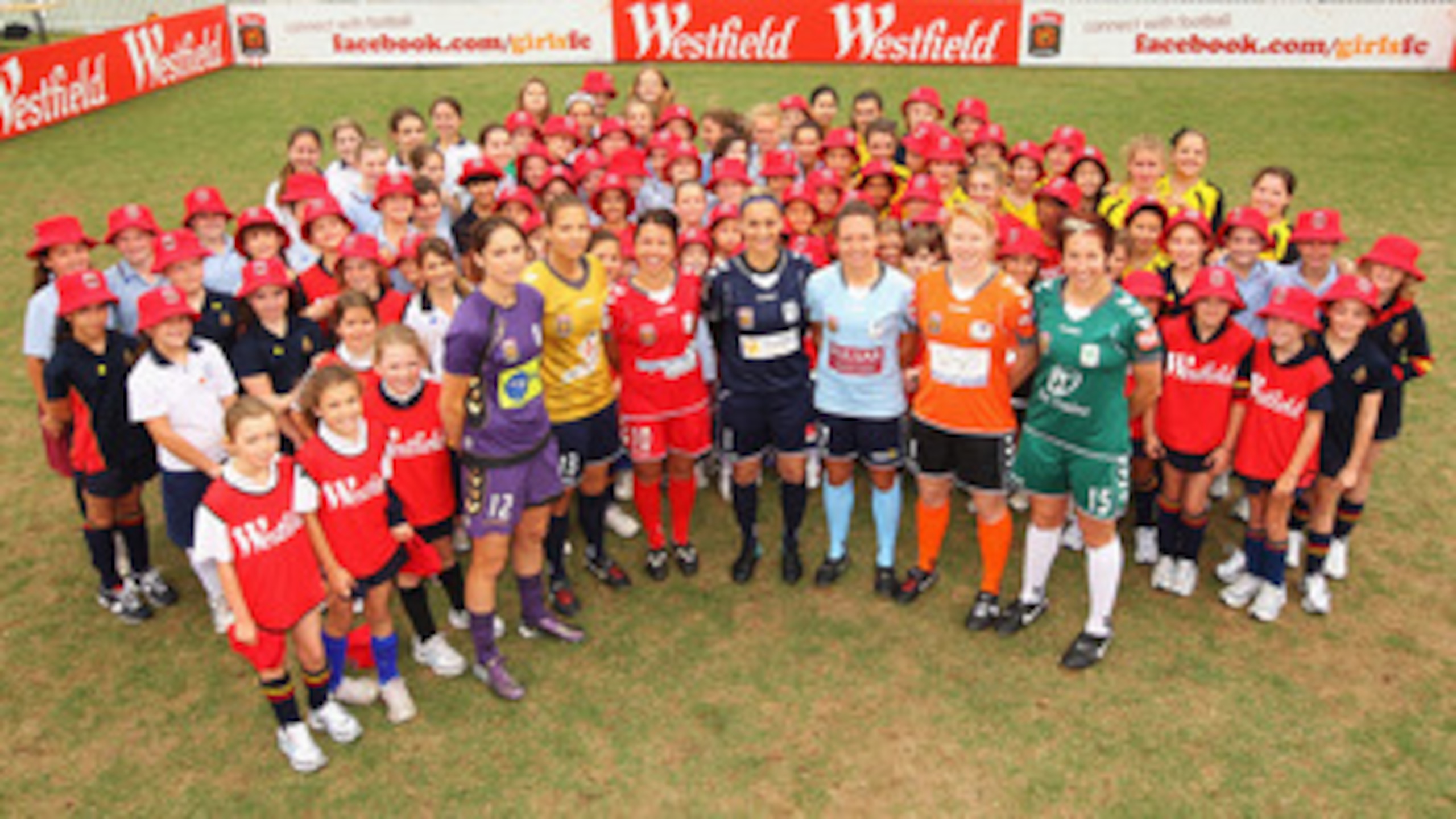 SYDNEY, AUSTRALIA - NOVEMBER 01: Kathryn Gill, Thea Slatyer, Victoria Balomenos, Melissa Barbieri, Kyah Simon, Clare Polkinghorne and Sally Shipard pose with school children during the W-League Season Launch at the University of NSW Campus on November 1, SYDNEY, AUSTRALIA - NOVEMBER 01: Kathryn Gill, Thea Slatyer, Victoria Balomenos, Melissa Barbieri, Kyah Simon, Clare Polkinghorne and Sally Shipard pose with school children during the W-League Season Launch at the University of NSW Campus on November 1,