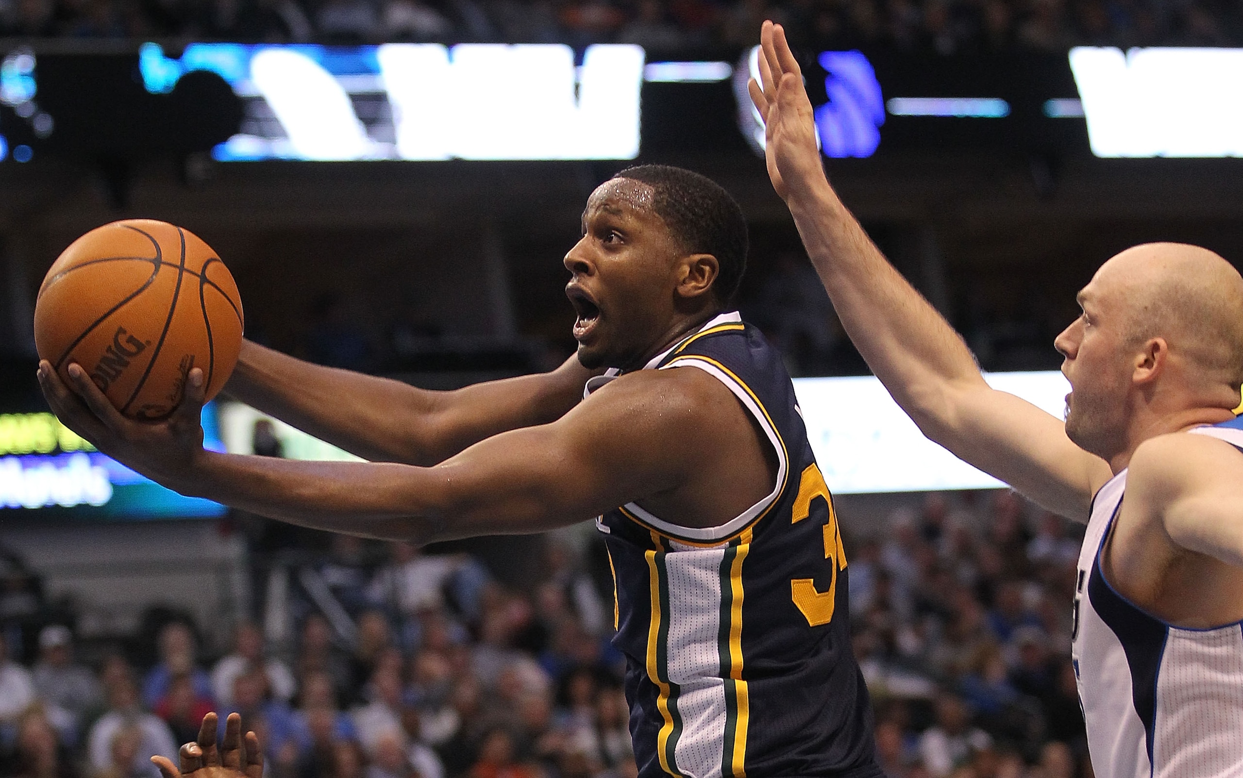 DALLAS, TX - FEBRUARY 23: Forward C.J. Miles #34 of the Utah Jazz takes a shot against Brian Cardinal #35 of the Dallas Mavericks at American Airlines Center on February 23, 2011 in Dallas, Texas. NOTE TO USER: User expressly acknowledges and agrees tha DALLAS, TX - FEBRUARY 23: Forward C.J. Miles #34 of the Utah Jazz takes a shot against Brian Cardinal #35 of the Dallas Mavericks at American Airlines Center on February 23, 2011 in Dallas, Texas. NOTE TO USER: User expressly acknowledges and agrees tha