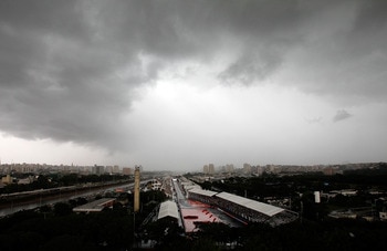 SAO POULO, BRAZIL - MAY 01:  Cars run through down the front stetch in the rain during the IndyCar Series  Itaipava SâÂ¹o Paulo Indy 300 on May 1, 2011 in Sao Poulo, Brazil.  (Photo by Jonathan Ferrey/Getty Images)