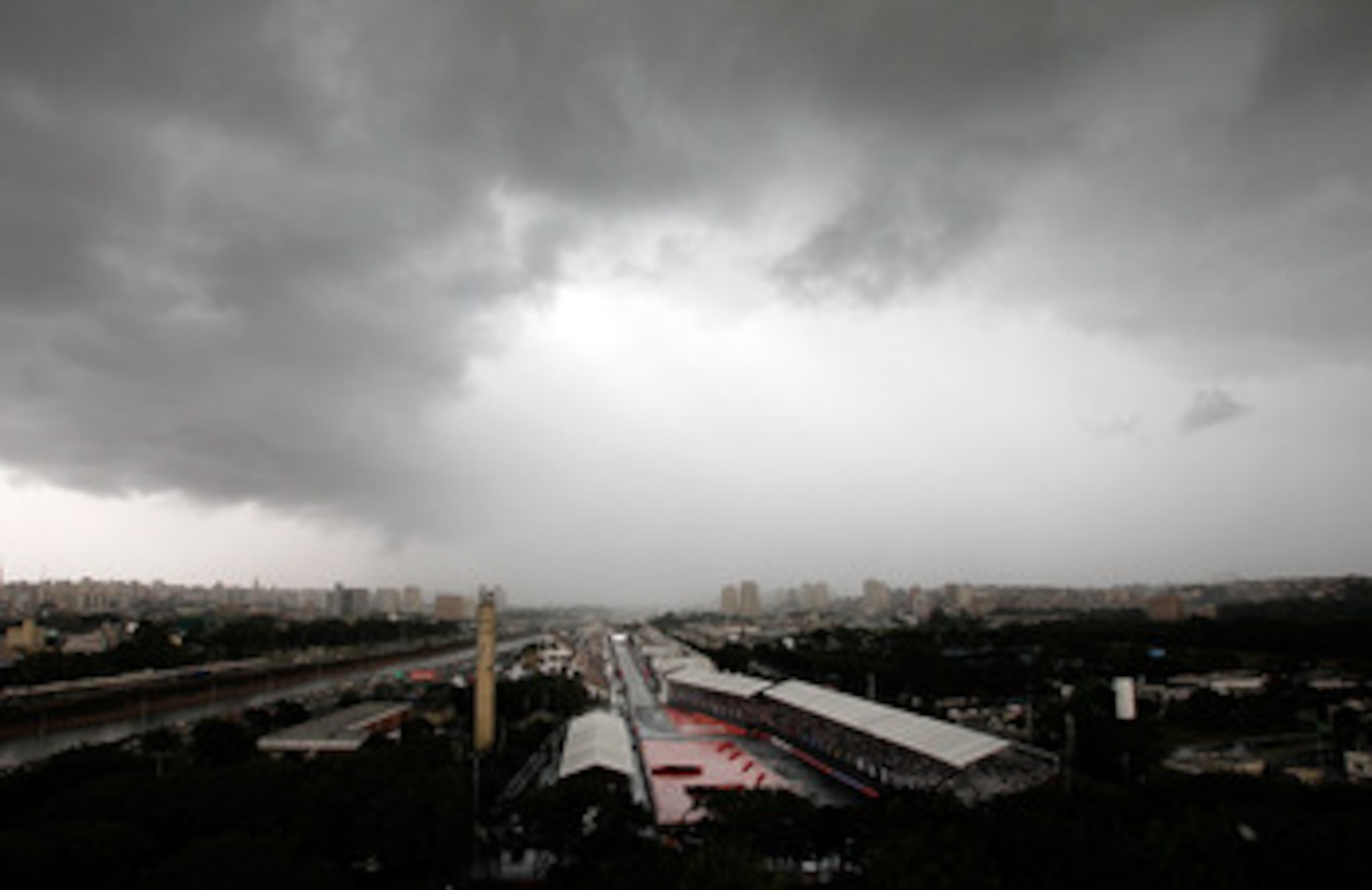 SAO POULO, BRAZIL - MAY 01:  Cars run through down the front stetch in the rain during the IndyCar Series  Itaipava SâÂ¹o Paulo Indy 300 on May 1, 2011 in Sao Poulo, Brazil.  (Photo by Jonathan Ferrey/Getty Images)