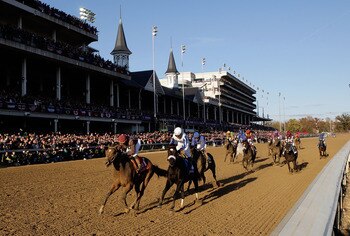 LOUISVILLE, KY - NOVEMBER 06:  Joel Rosario aboard Dakota Phone (left  in red)  wins the Dirt Mile during the Breeders' Cup World Championships at Churchill Downs on November 6, 2010 in Louisville, Kentucky.  (Photo by Andy Lyons/Getty Images)