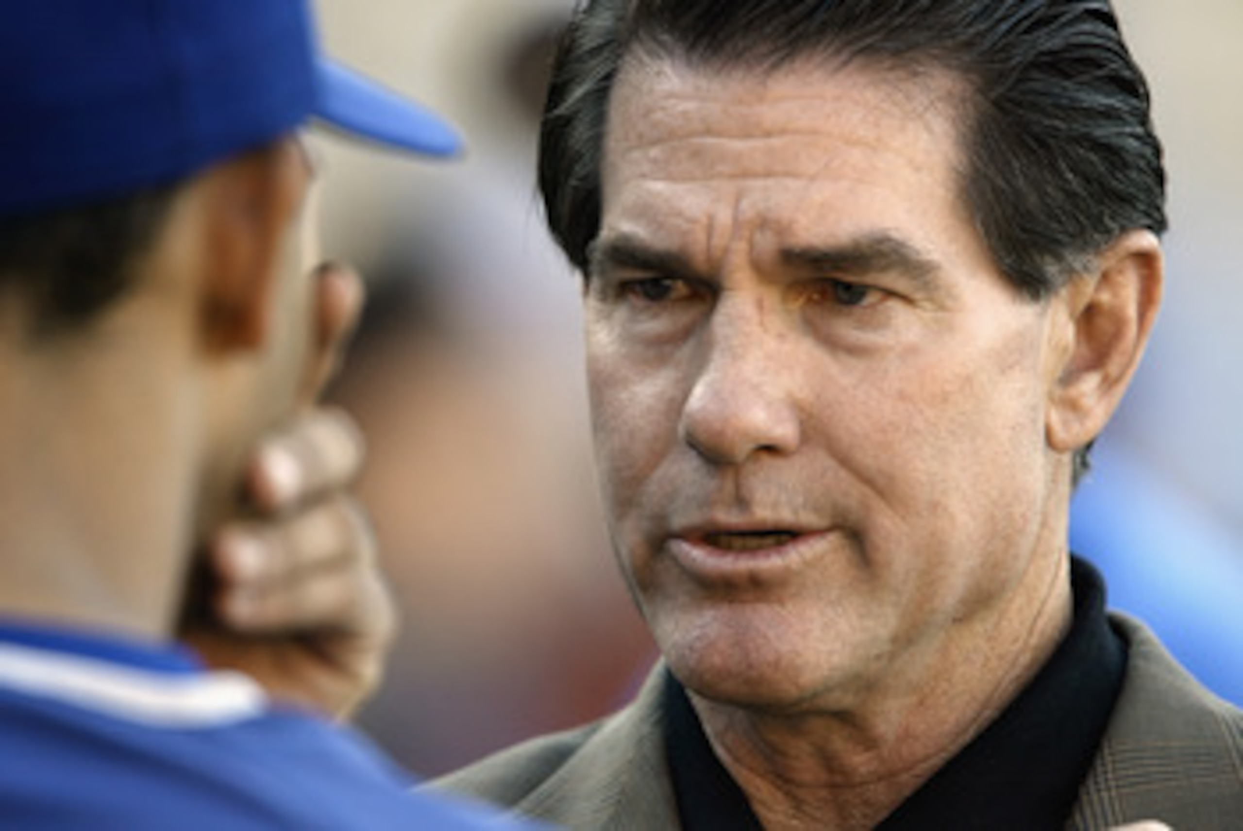 LOS ANGELES - AUGUST 8:  Former Los Angeles Dodger Steve Garvey talks with Alex Cora #13 about hitting before the game against the Chicago Cubs on August 8, 2003 at Dodger Stadium in Los Angeles, California.  The Dodgers defeated the Cubs 3-1.  (Photo by