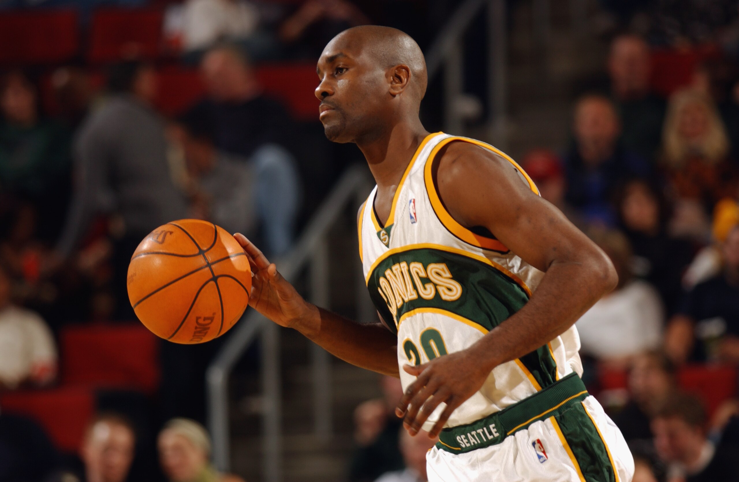 SEATTLE - OCTOBER 30:  Gary Payton #20 of the Seattle Sonics moves the ball upcourt during the game against the Phoenix Suns at Key Arena on October 30, 2002 in Seattle, Washington.  The Sonics won 86-73.  NOTE TO USER: User expressly acknowledges and agr