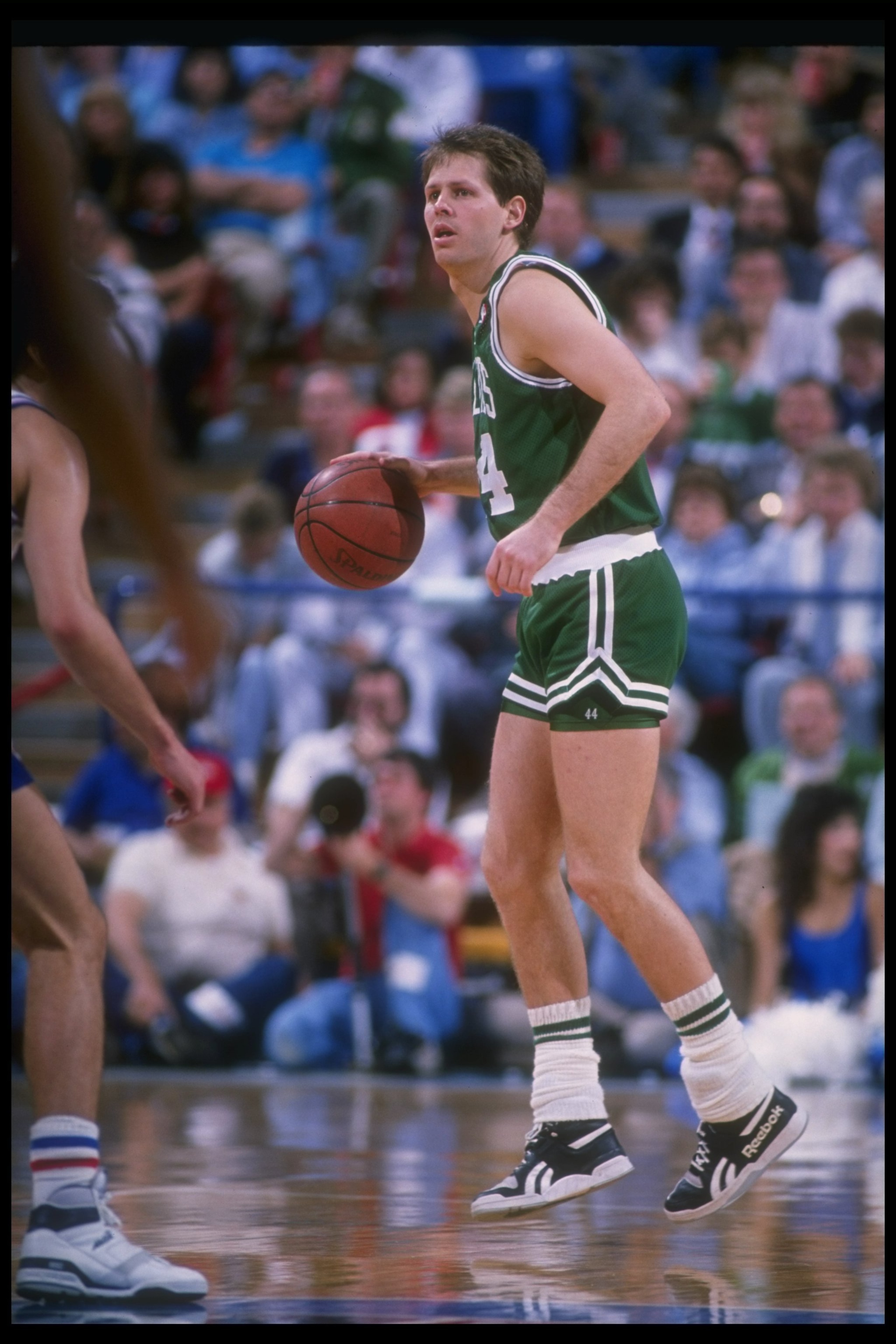 Danny Ainge of the Boston Celtics moves the ball during a game.