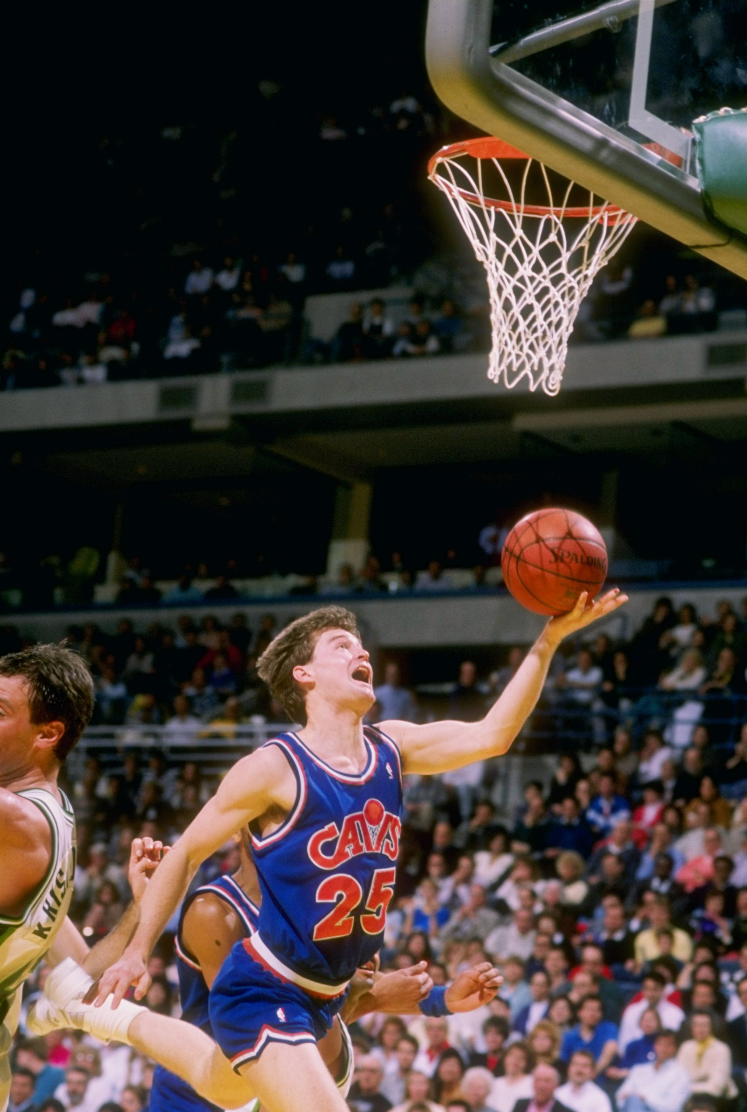 Guard Mark Price of the Cleveland Cavaliers heads for the basket during a game.
