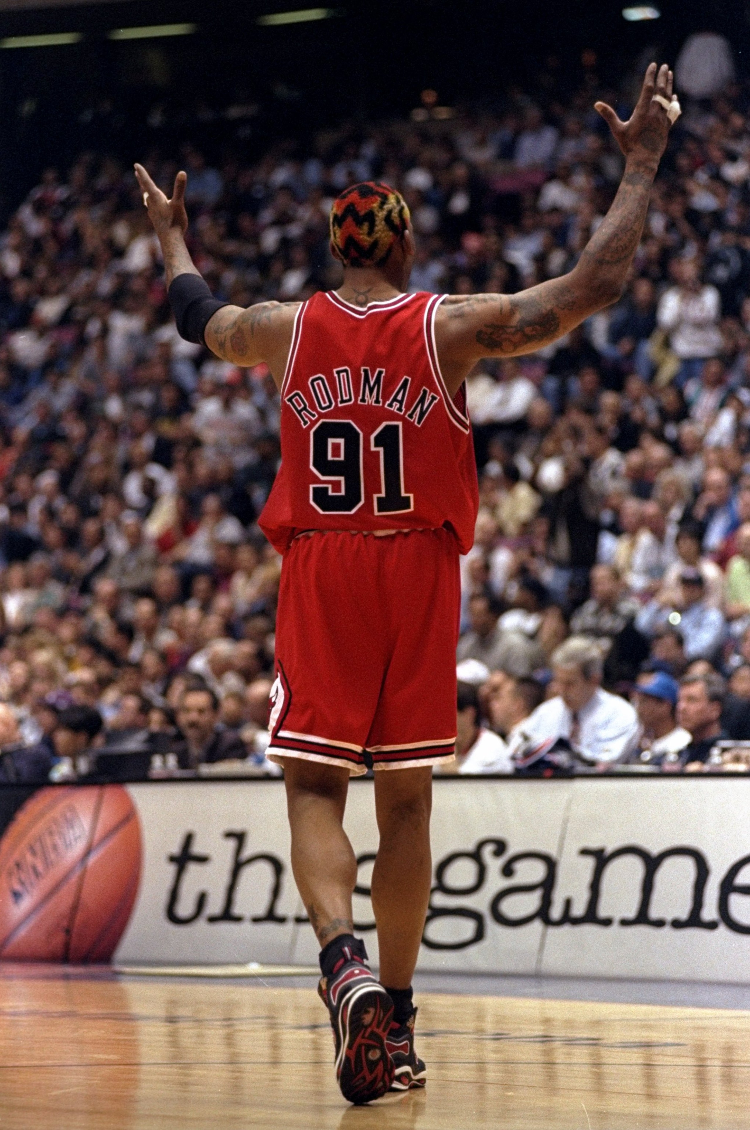 29 Apr 1998:  Dennis Rodman #91 of the Chicago Bulls gestures during a First Round Playoff Game against the New Jersey Nets at the Continental Airlines Arena in East Rutherford, New Jersey. The Bulls defeated the Nets 116-101.