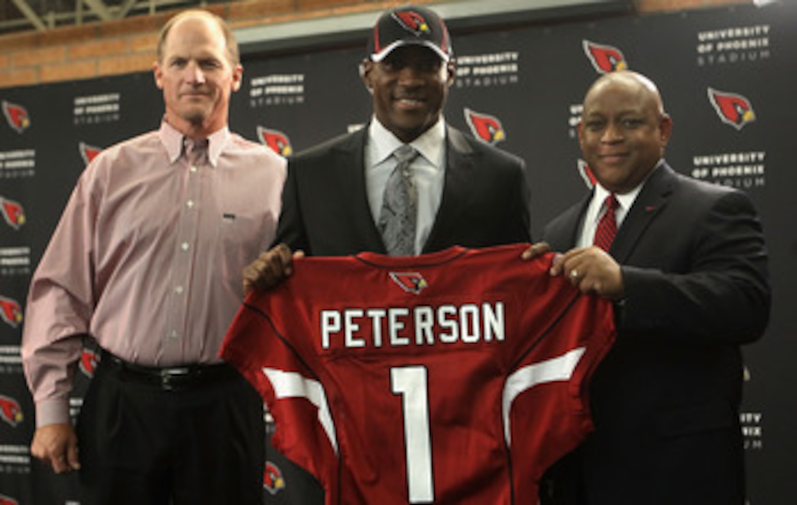 TEMPE, AZ - APRIL 29:  (L-R) Head coach Ken Whisenhunt, first round draft pick Patrick Peterson and general manager Rod Graves of the Arizona Cardinals pose together during a press conference to introduce Peterson at the team's training center auditorium 