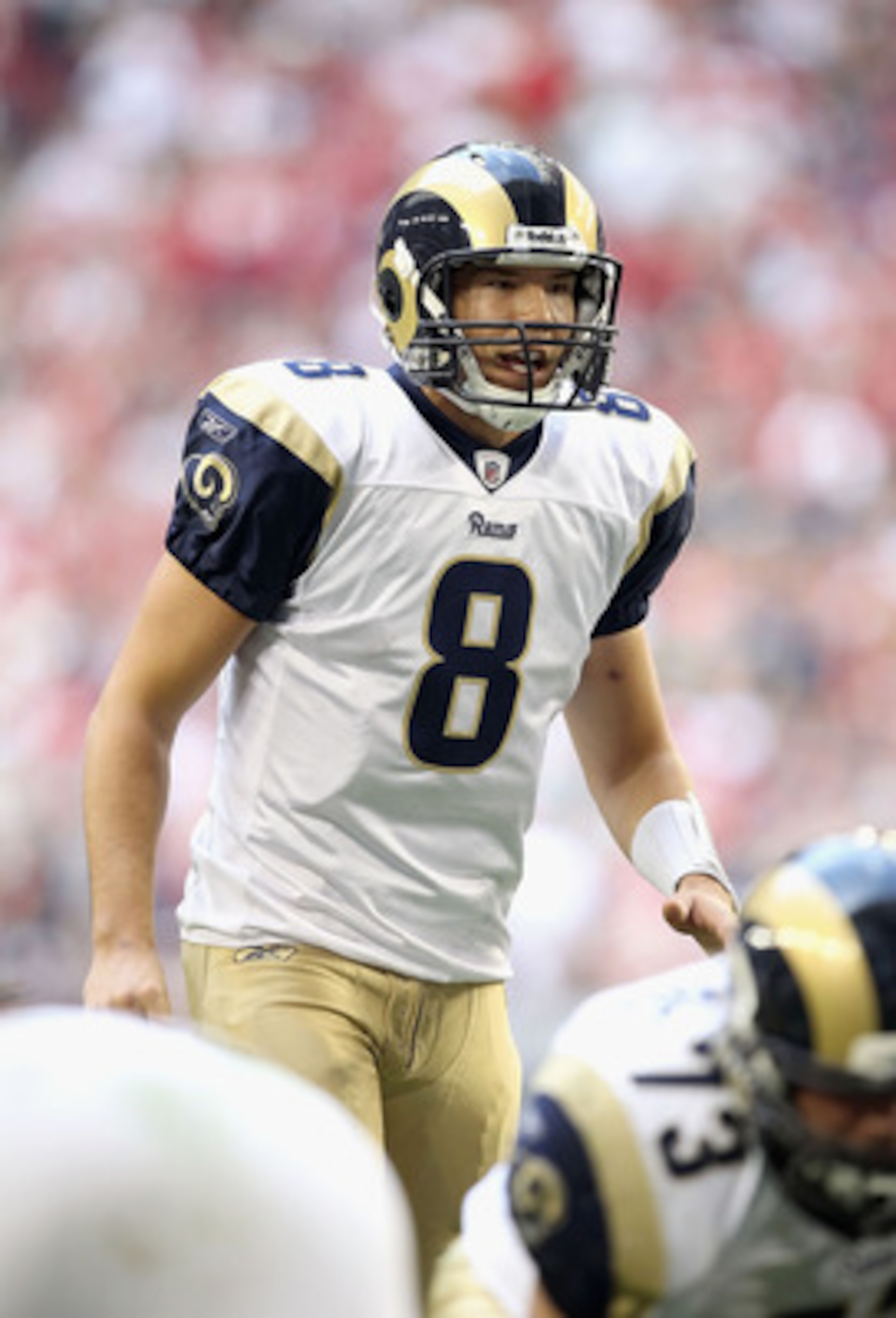 GLENDALE, AZ - DECEMBER 05:  Quarterback Sam Bradford #8 of the St. Louis Rams prepares to snap the ball during the NFL game against the Arizona Cardinals at the University of Phoenix Stadium on December 5, 2010 in Glendale, Arizona.  The Rams defeated th