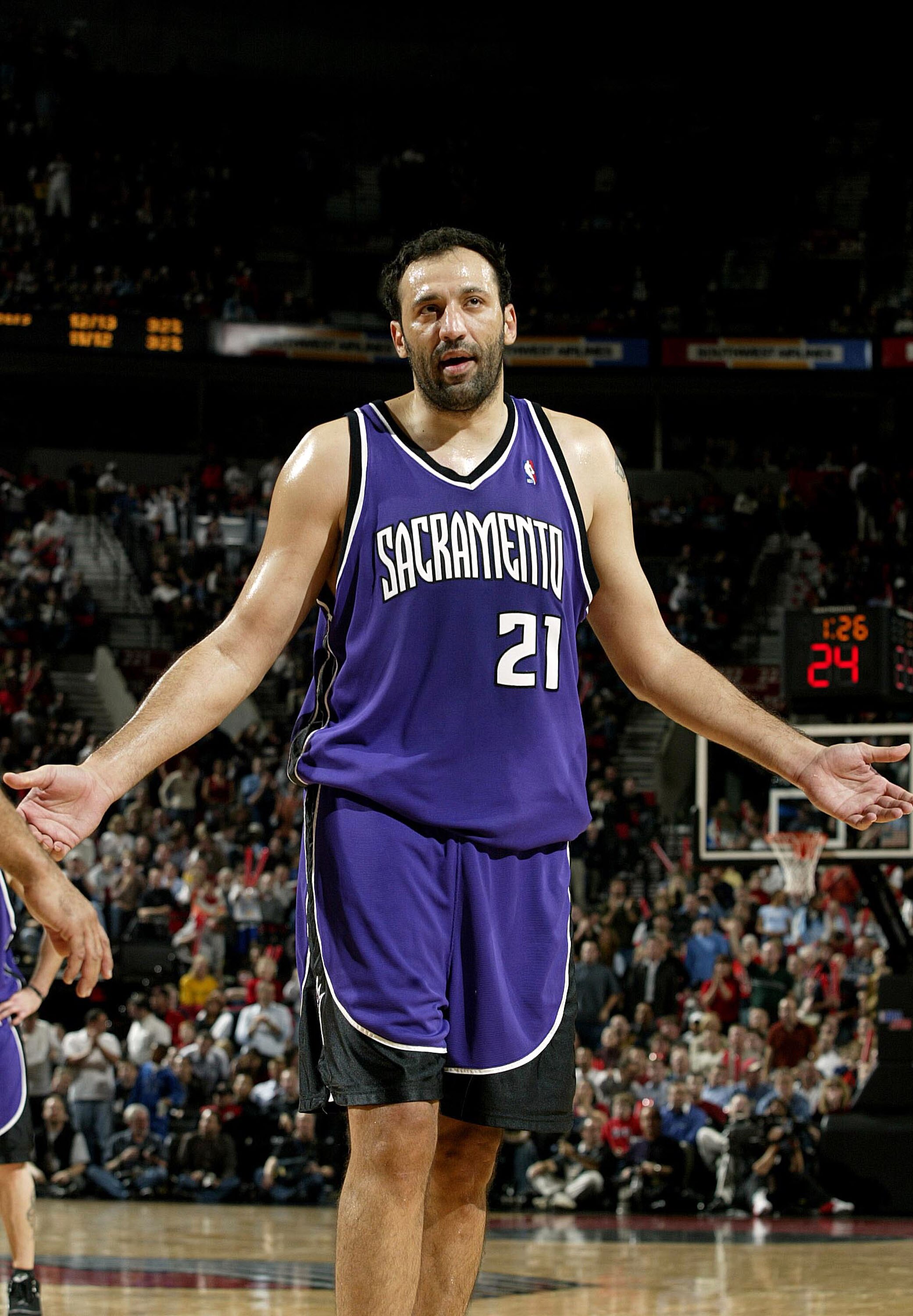 PORTLAND, OR - NOVEMBER13:  Vlade Divac #21 of the Sacramento Kings reacts to fouling out against the Portland Trail Blazers November 13, 2003 at the Rose Garden in Portland, Oregon.  NOTE TO USER: User expressly acknowledges and agrees that, by downloadi