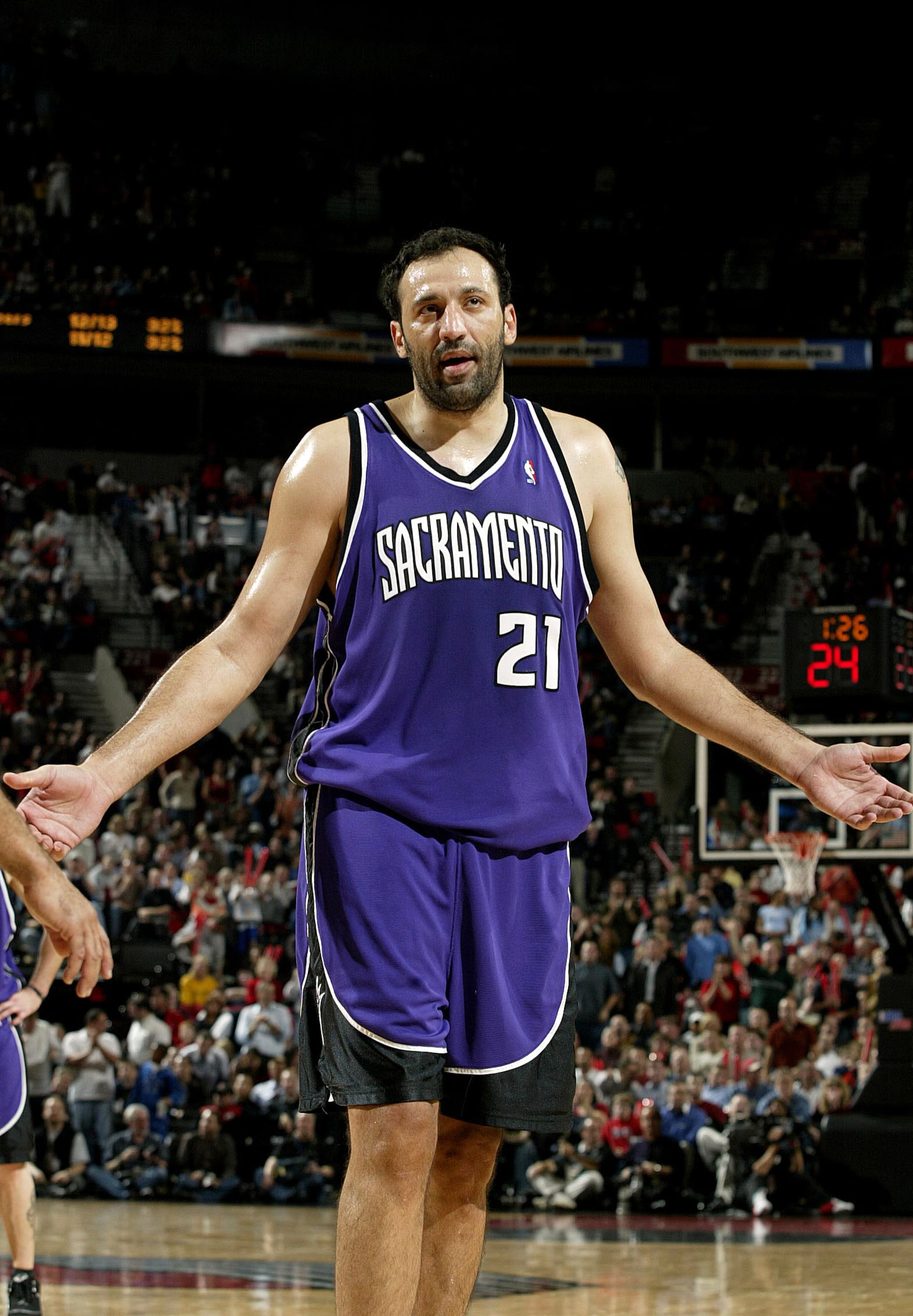 PORTLAND, OR - NOVEMBER13:  Vlade Divac #21 of the Sacramento Kings reacts to fouling out against the Portland Trail Blazers November 13, 2003 at the Rose Garden in Portland, Oregon.  NOTE TO USER: User expressly acknowledges and agrees that, by downloadi