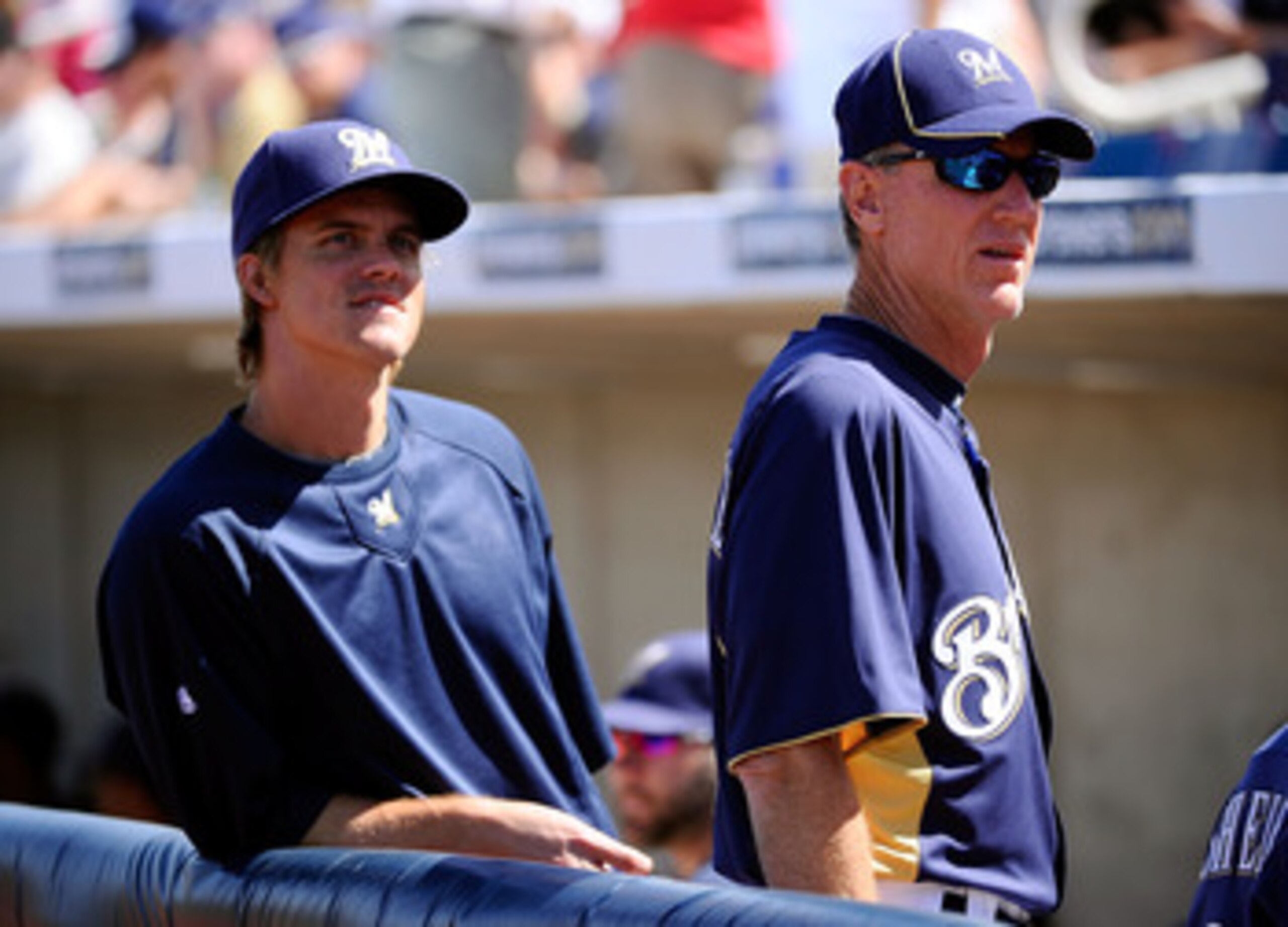 PHOENIX, AZ - MARCH 10:  Pitcher Zack Greinke #13  of the Milwaukee Brewrers stands near manager Ron Roenicke during the spring training baseball game against Colorado Rockies at Maryvale Baseball Park on March 10, 2011 in Phoenix, Arizona.  (Photo by Kev