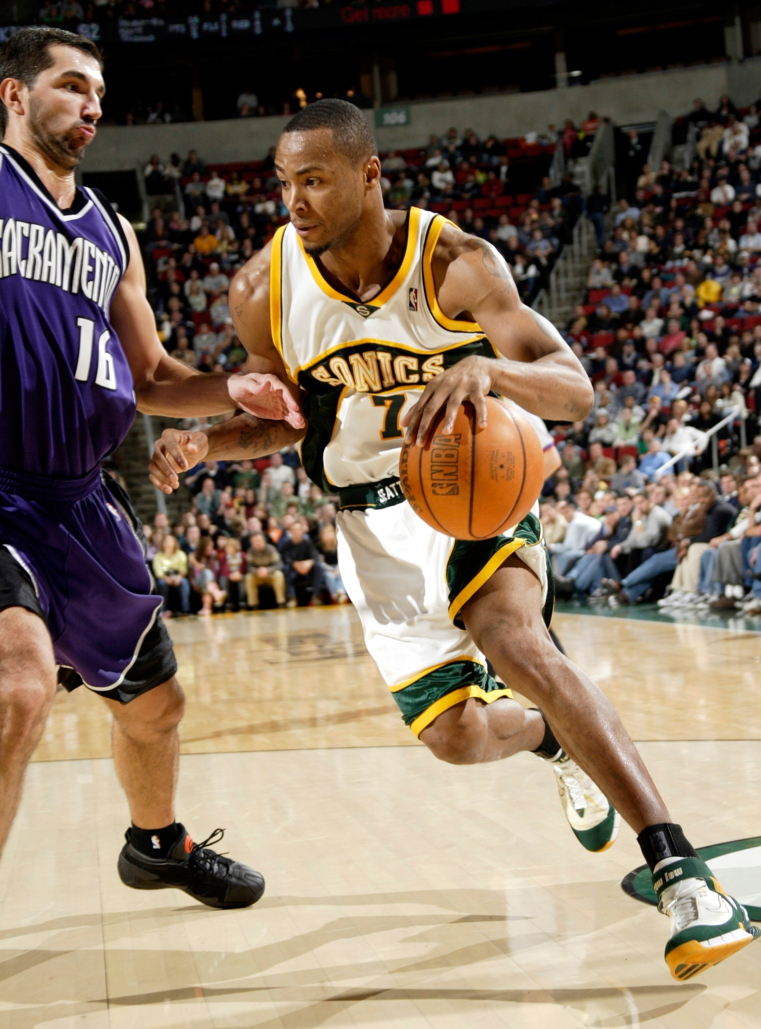 SEATTLE - NOVEMBER 20:  Rashard Lewis #7 of the Seattle SuperSonics drives against Peja Stojakovic #54 of the Sacramento Kings on November 20, 2005 at Key Arena in Seattle, Washington.  NOTE TO USER: User expressly acknowledges and agrees that, by downloa