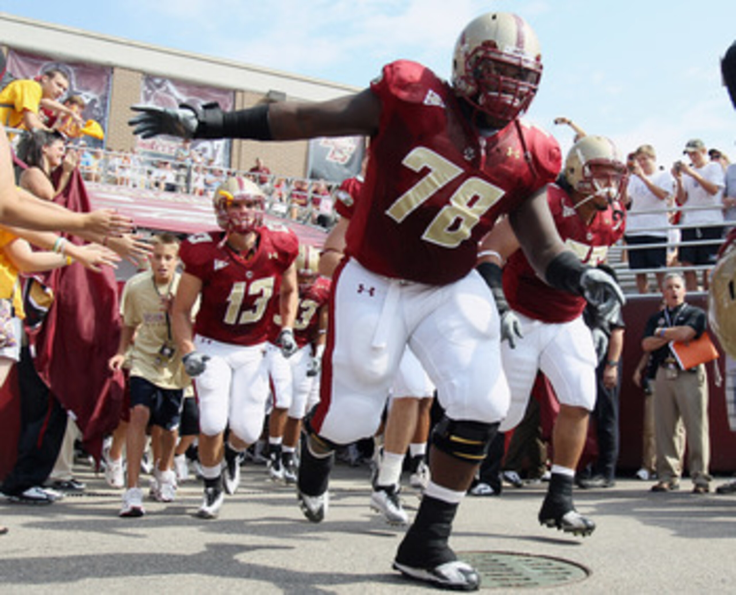 CHESTNUT HILL, MA - SEPTEMBER 25:  Thomas Claiborne #78 of the Boston College Eagles leads the team out on the field before the game against the Virginia Tech Hokies on September 25, 2010 at Alumni Stadium in Chestnut Hill, Massachusetts.  (Photo by Elsa/