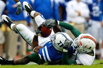 DURHAM, NC - OCTOBER 18:  Receiver Raphael Chestnut #5 of the Duke Blue Devils pulls in this reception against DeMarcus Van Dyke #8 of the Miami Hurricanes during the game at Wallace Wade Stadium on October 18, 2008 in Durham, North Carolina.  (Photo by K