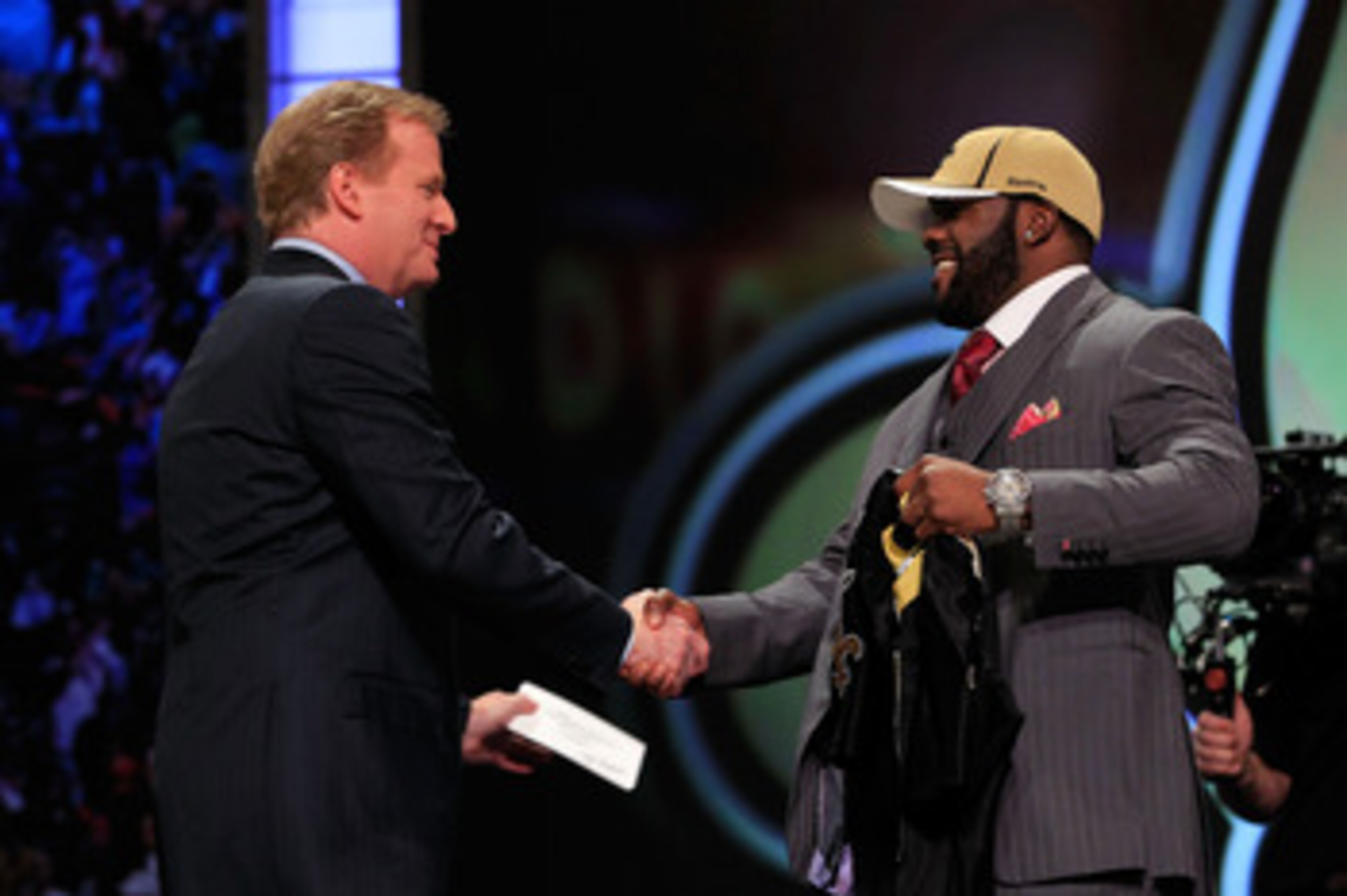 NEW YORK, NY - APRIL 28:  NFL Commissioner Roger Goodell (L) greets Mark Ingram, #28 overall pick by the New Orleans Saints, on stage during the 2011 NFL Draft at Radio City Music Hall on April 28, 2011 in New York City.  (Photo by Chris Trotman/Getty Ima
