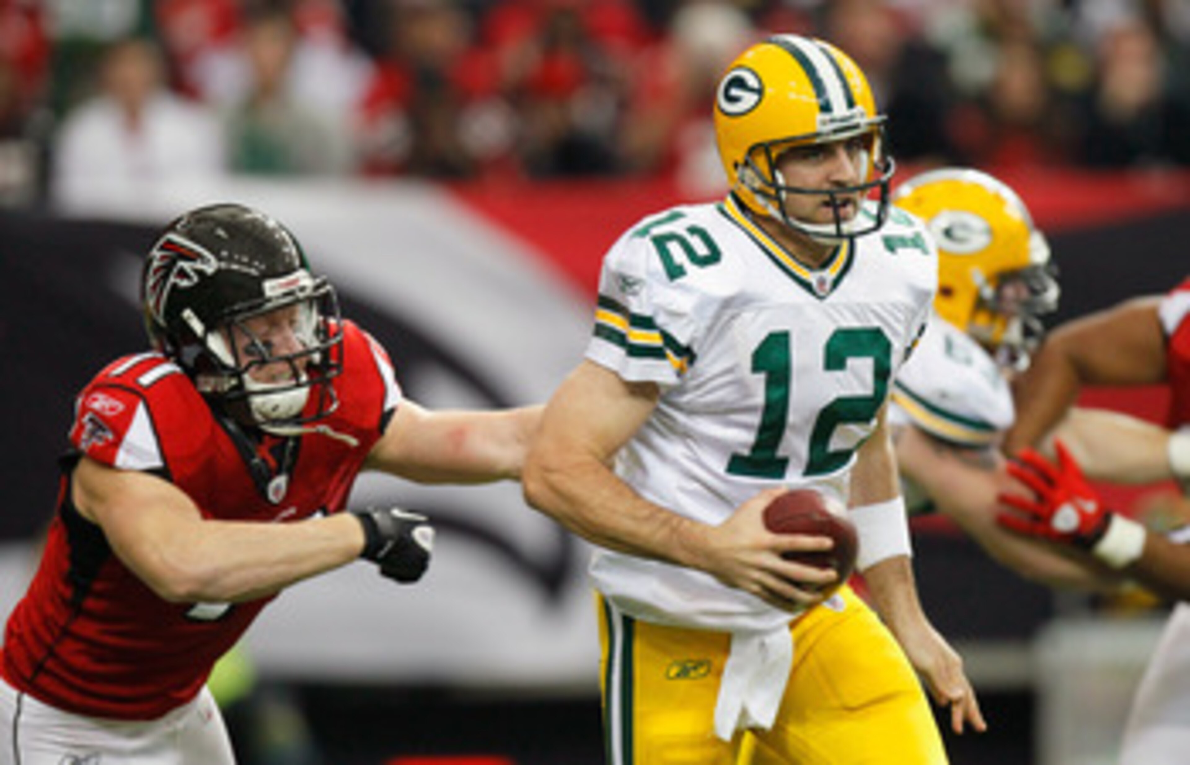 ATLANTA - NOVEMBER 28:  Kroy Biermann #71 of the Atlanta Falcons chases down Aaron Rodgers #12 of the Green Bay Packers at Georgia Dome on November 28, 2010 in Atlanta, Georgia.  (Photo by Kevin C. Cox/Getty Images)