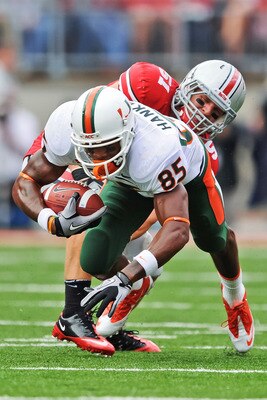 COLUMBUS, OH - SEPTEMBER 11:  Ross Homan #51 of the Ohio State Buckeyes tackles Leonard Hankerson #85 of the Miami Hurricanes at Ohio Stadium on September 11, 2010 in Columbus, Ohio.  (Photo by Jamie Sabau/Getty Images)