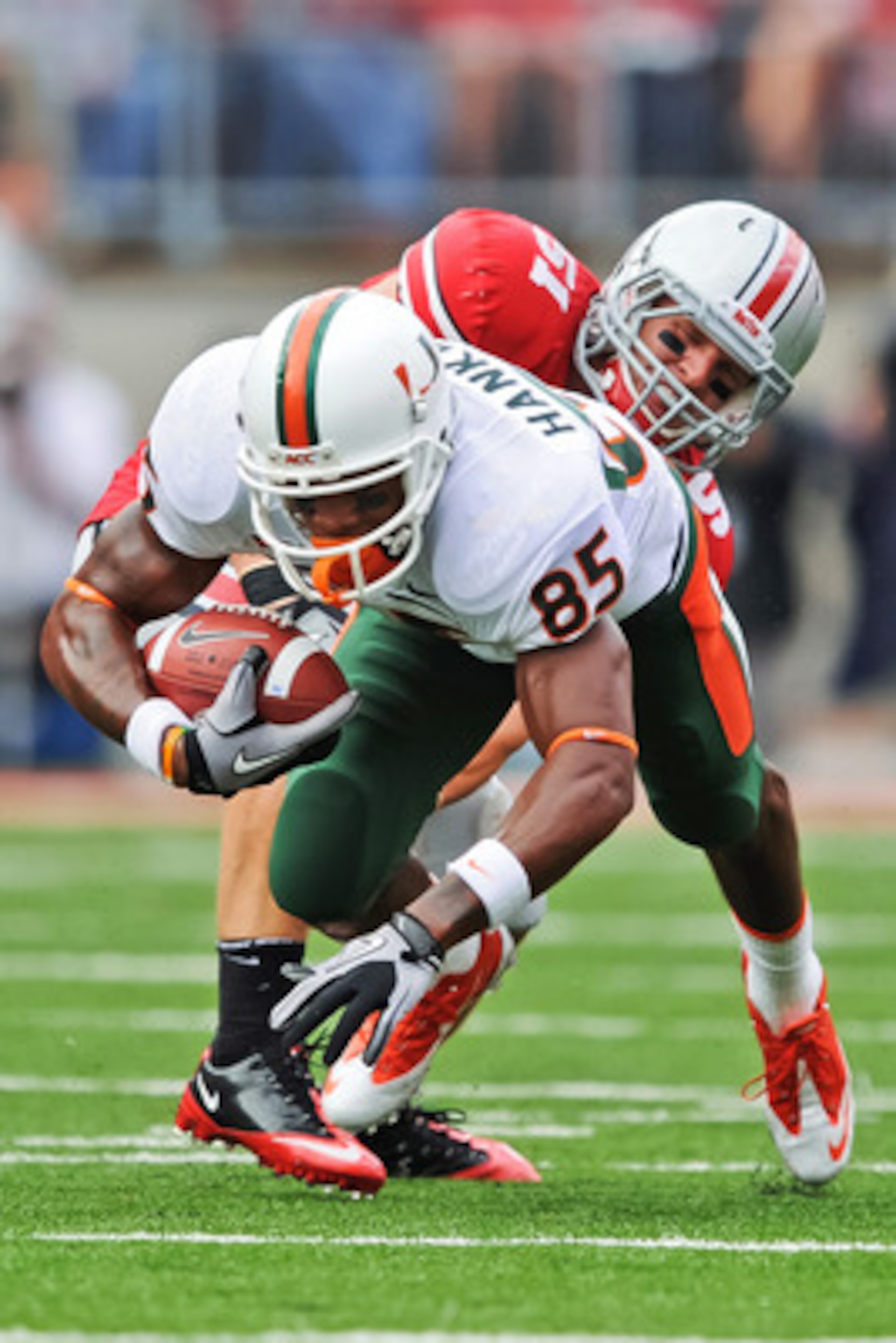 COLUMBUS, OH - SEPTEMBER 11:  Ross Homan #51 of the Ohio State Buckeyes tackles Leonard Hankerson #85 of the Miami Hurricanes at Ohio Stadium on September 11, 2010 in Columbus, Ohio.  (Photo by Jamie Sabau/Getty Images)
