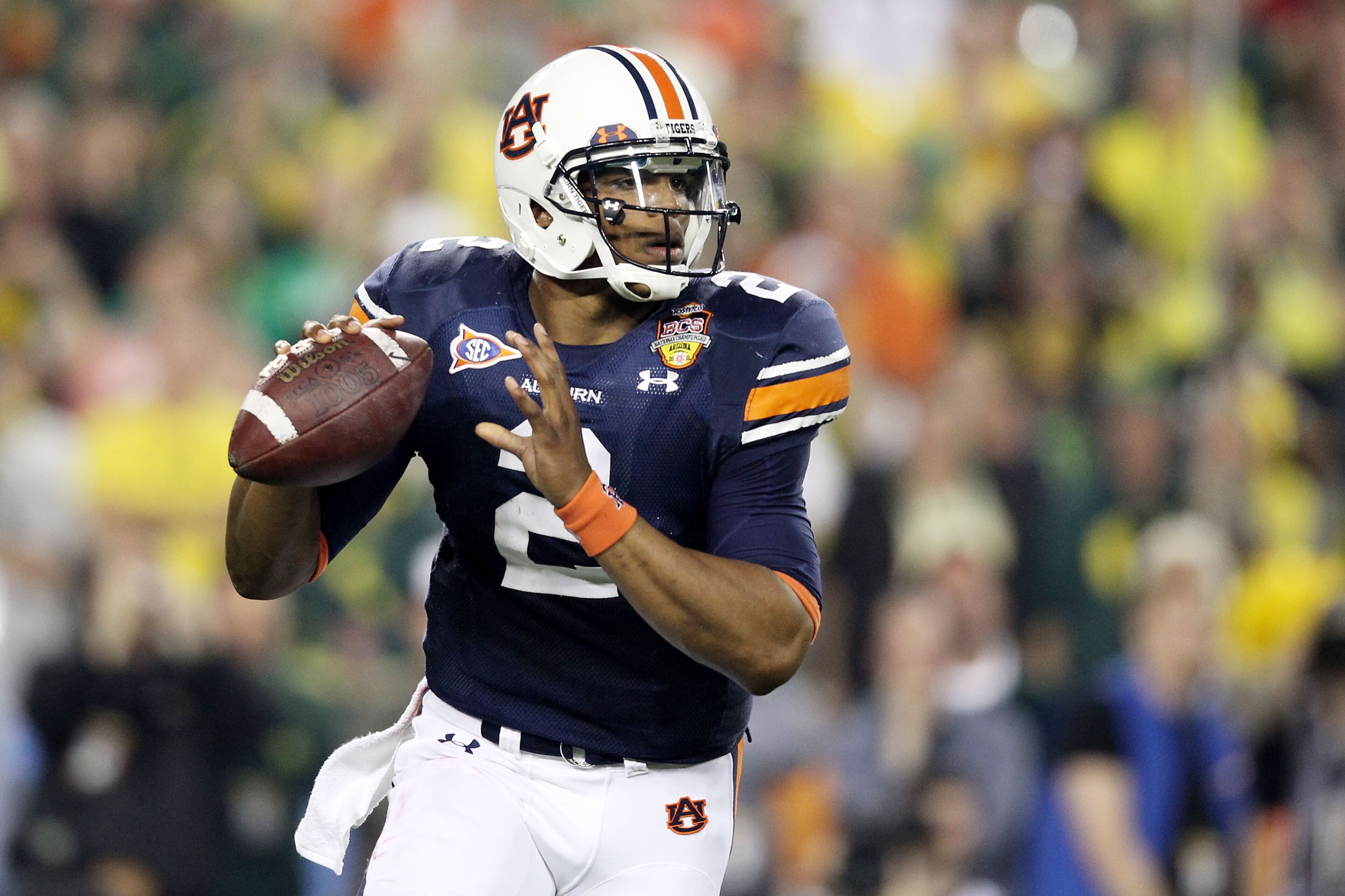 GLENDALE, AZ - JANUARY 10:  Cameron Newton #2 of the Auburn Tigers scrambles against the Oregon Ducks during the Tostitos BCS National Championship Game at University of Phoenix Stadium on January 10, 2011 in Glendale, Arizona.  (Photo by Christian Peters