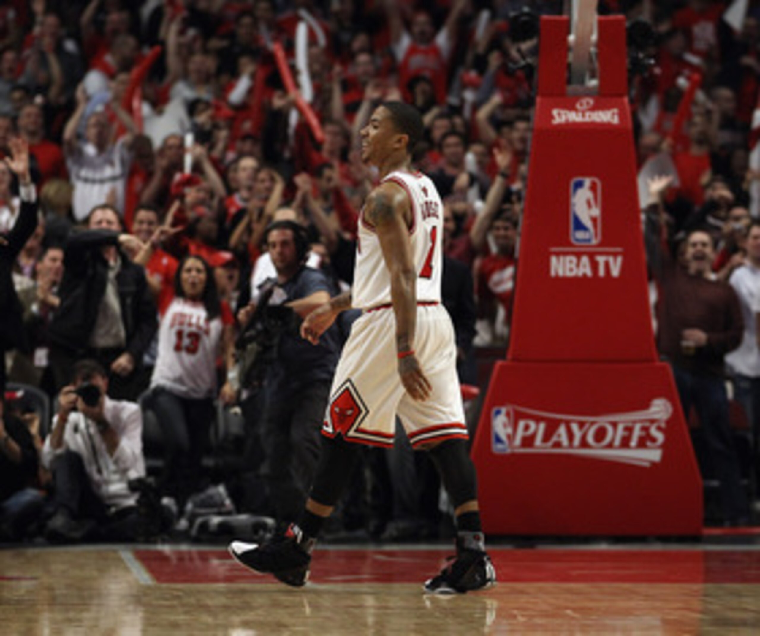 CHICAGO, IL - APRIL 26: Derrick Rose #1 of the Chicago Bulls smiles as he walks off of the court as fans cheer during a time-out against the Indiana Pacers in Game Five of the Eastern Conference Quarterfinals in the 2011 NBA Playoffs at the United Center