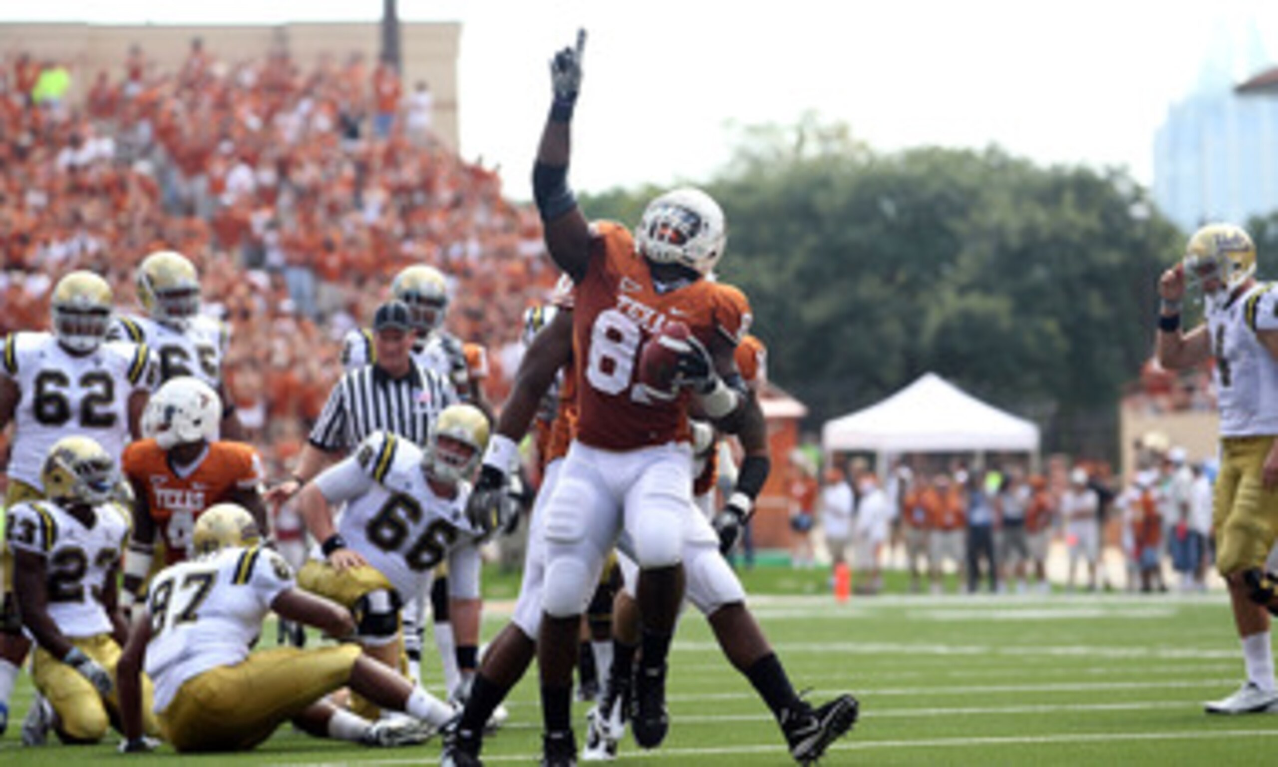 AUSTIN, TX - SEPTEMBER 25: Defensive end Sam Acho #81 of the Texas Longhorns reacts after making a fumble recovery against the UCLA Bruins at Darrell K Royal-Texas Memorial Stadium on September 25, 2010 in Austin, Texas. (Photo by Ronald Martinez/Getty AUSTIN, TX - SEPTEMBER 25: Defensive end Sam Acho #81 of the Texas Longhorns reacts after making a fumble recovery against the UCLA Bruins at Darrell K Royal-Texas Memorial Stadium on September 25, 2010 in Austin, Texas. (Photo by Ronald Martinez/Getty