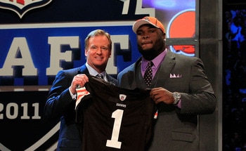NEW YORK, NY - APRIL 28:  NFL Commissioner Roger Goodell (L) poses for a photo with Phil Taylor, #21 overall pick by the Cleveland Browns, on stage during the 2011 NFL Draft at Radio City Music Hall on April 28, 2011 in New York City.  (Photo by Chris Tro