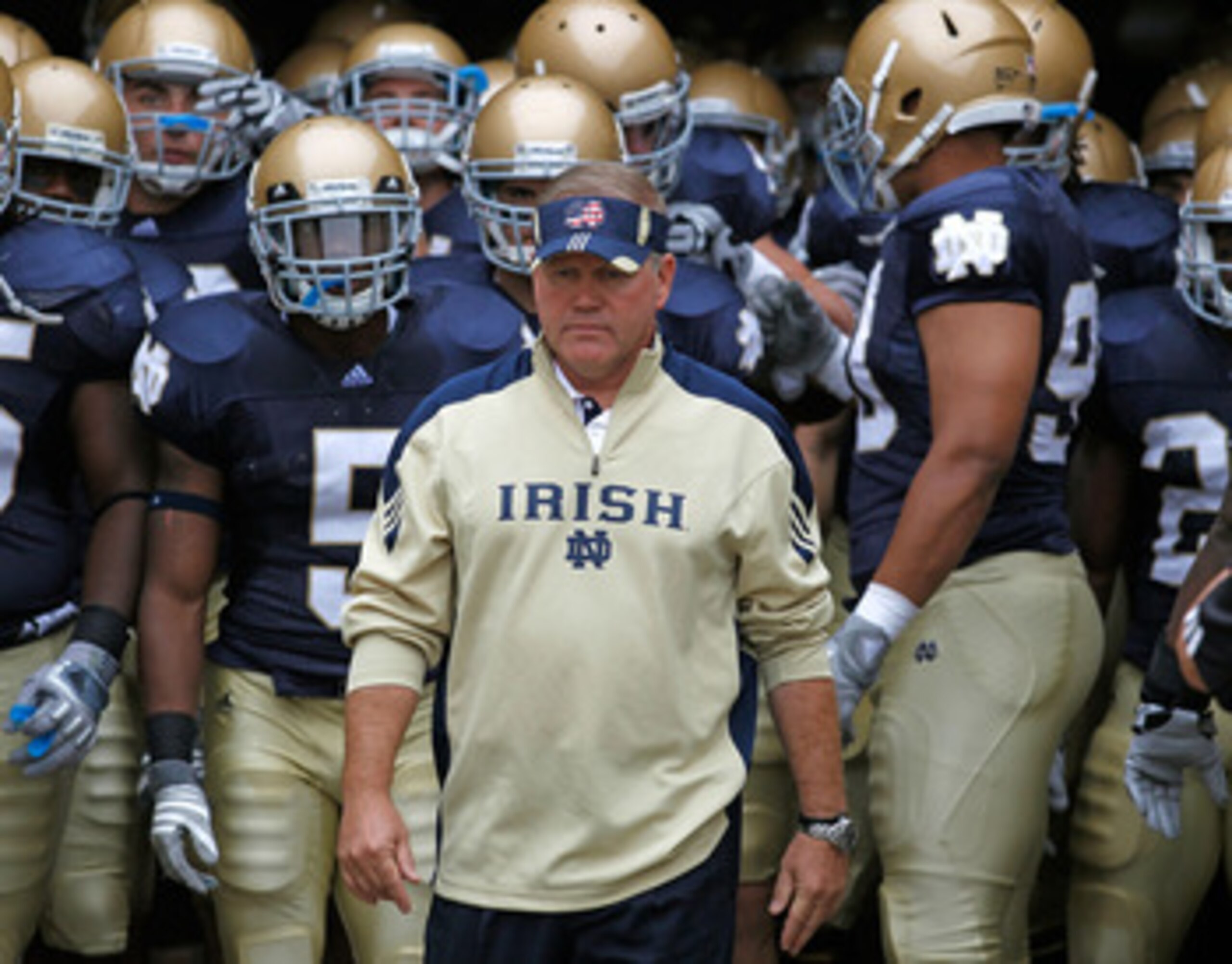 SOUTH BEND, IN - SEPTEMBER 11: Head coach Brian Kelly of the Notre Dame Fighting Irish waits to enter the field with his team before a game against the Michigan Wolverines at Notre Dame Stadium on September 11, 2010 in South Bend, Indiana. Michigan defeat