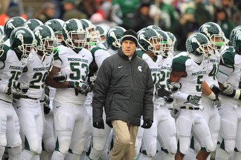 STATE COLLEGE, PA - NOVEMBER 27: Head coach Mark Dantonio of the Michigan State Spartans leads his team onto the field before a game against the Penn State Nittany Lions on November 27, 2010 at Beaver Stadium in State College, Pennsylvania. The Spartans w STATE COLLEGE, PA - NOVEMBER 27: Head coach Mark Dantonio of the Michigan State Spartans leads his team onto the field before a game against the Penn State Nittany Lions on November 27, 2010 at Beaver Stadium in State College, Pennsylvania. The Spartans w