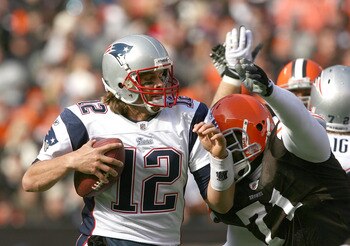 CLEVELAND - NOVEMBER 07:  Quarterback Tom Brady #12 of the New England Patriots is sacked by defensive lineman Ahtyba Rubin #71 of the Cleveland Browns at Cleveland Browns Stadium on November 7, 2010 in Cleveland, Ohio.  (Photo by Matt Sullivan/Getty Imag