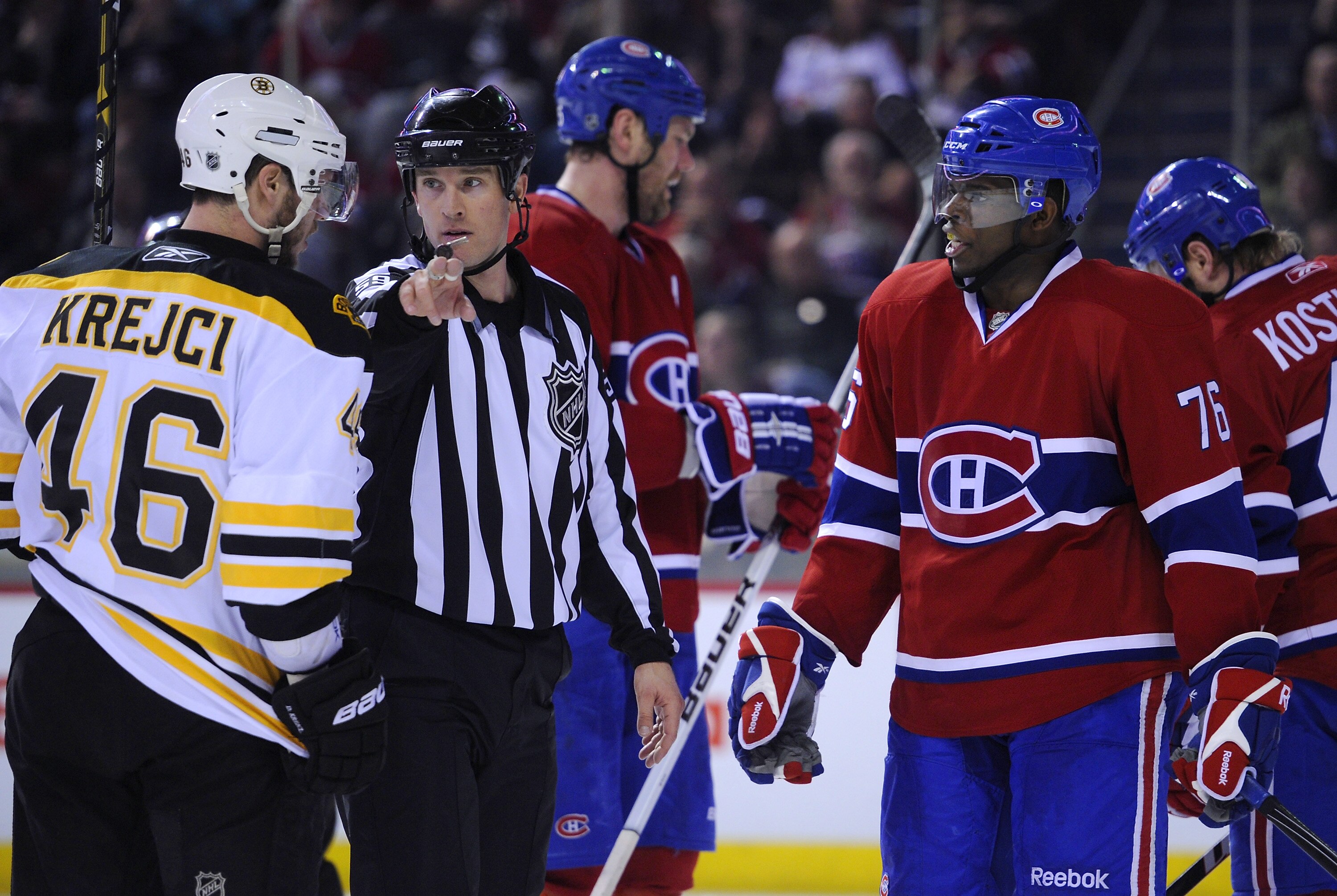 MONTREAL, CANADA - APRIL 21:  David Krejci #46 of the Boston Bruins and P.K. Subban #76 of the Montreal Canadiens are separated after a whistle by linesman Steve Barton (59) in Game Four of the Eastern Conference Quarterfinals during the 2011 NHL Stanley