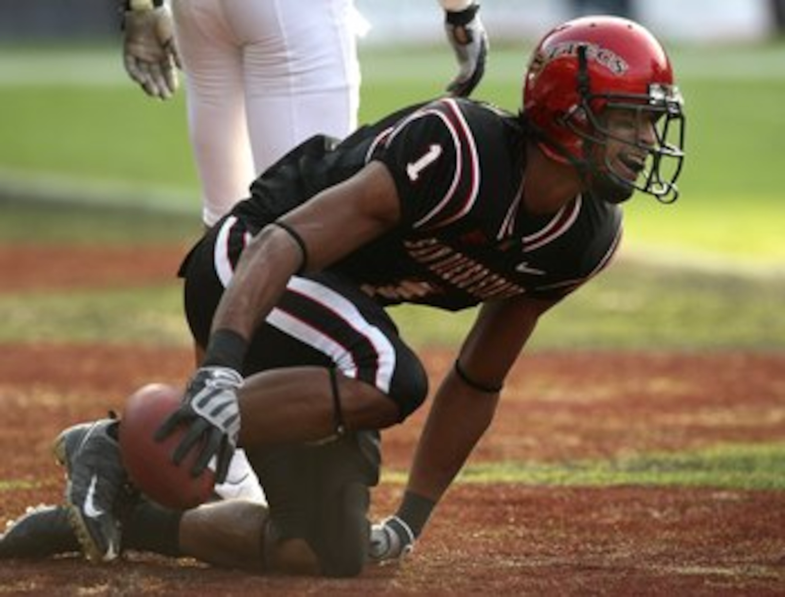 SAN DIEGO - NOVEMBER 7:  Wide receiver DeMarco Sampson #1 of  the San Diego State Aztecs reacts after making a touchdown catch against the Texas Christian University Horned Frogs on November 7, 2009 at Qualcomm Stadium in San Diego, California.   TCU won 