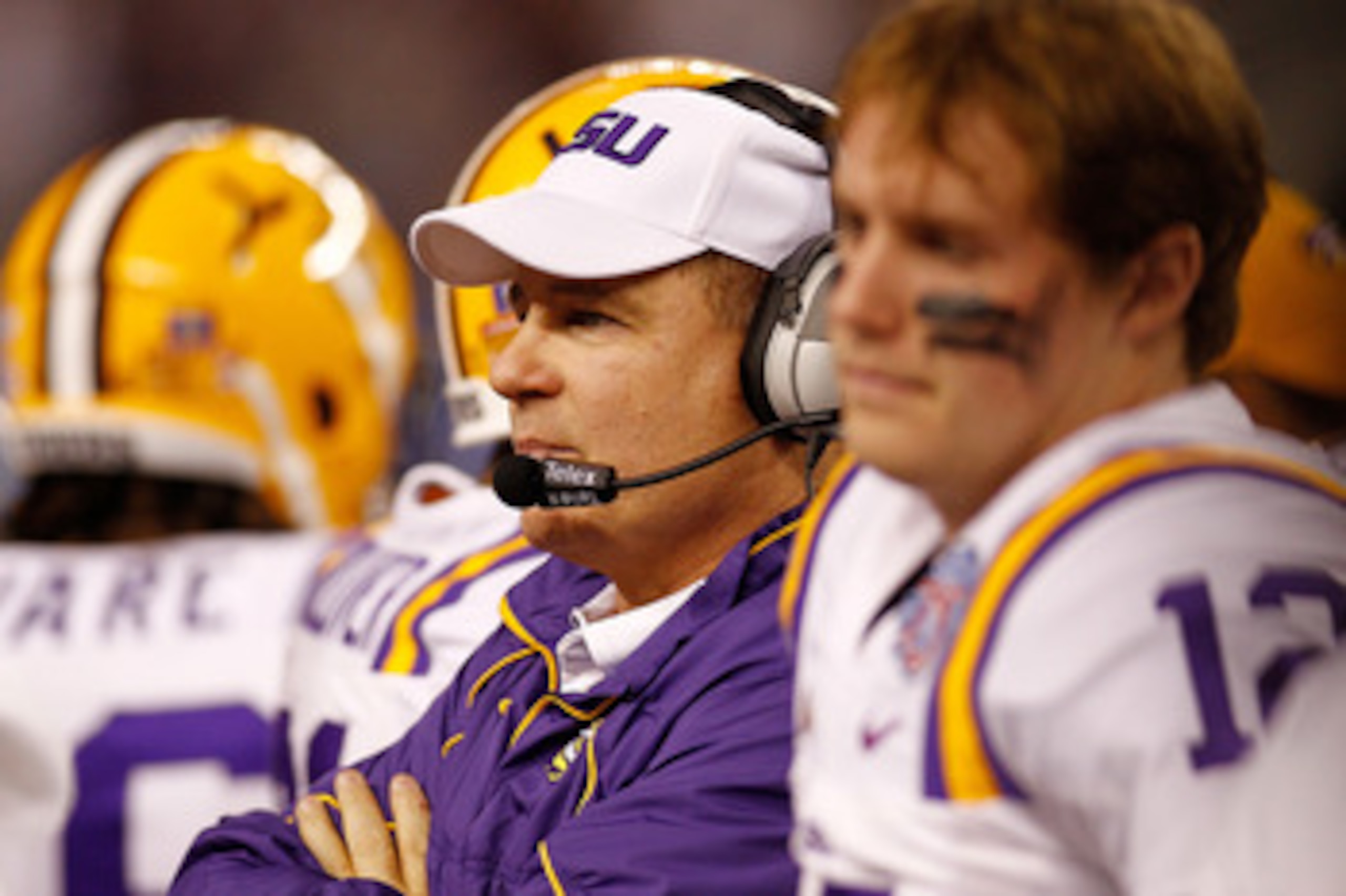ARLINGTON, TX - JANUARY 07:  Head coach Les Miles of the Louisiana State University Tigers talks wthi his team during a timeout against the Texas A&M Aggies during the AT&T Cotton Bowl at Cowboys Stadium on January 7, 2011 in Arlington, Texas.  (Photo by 